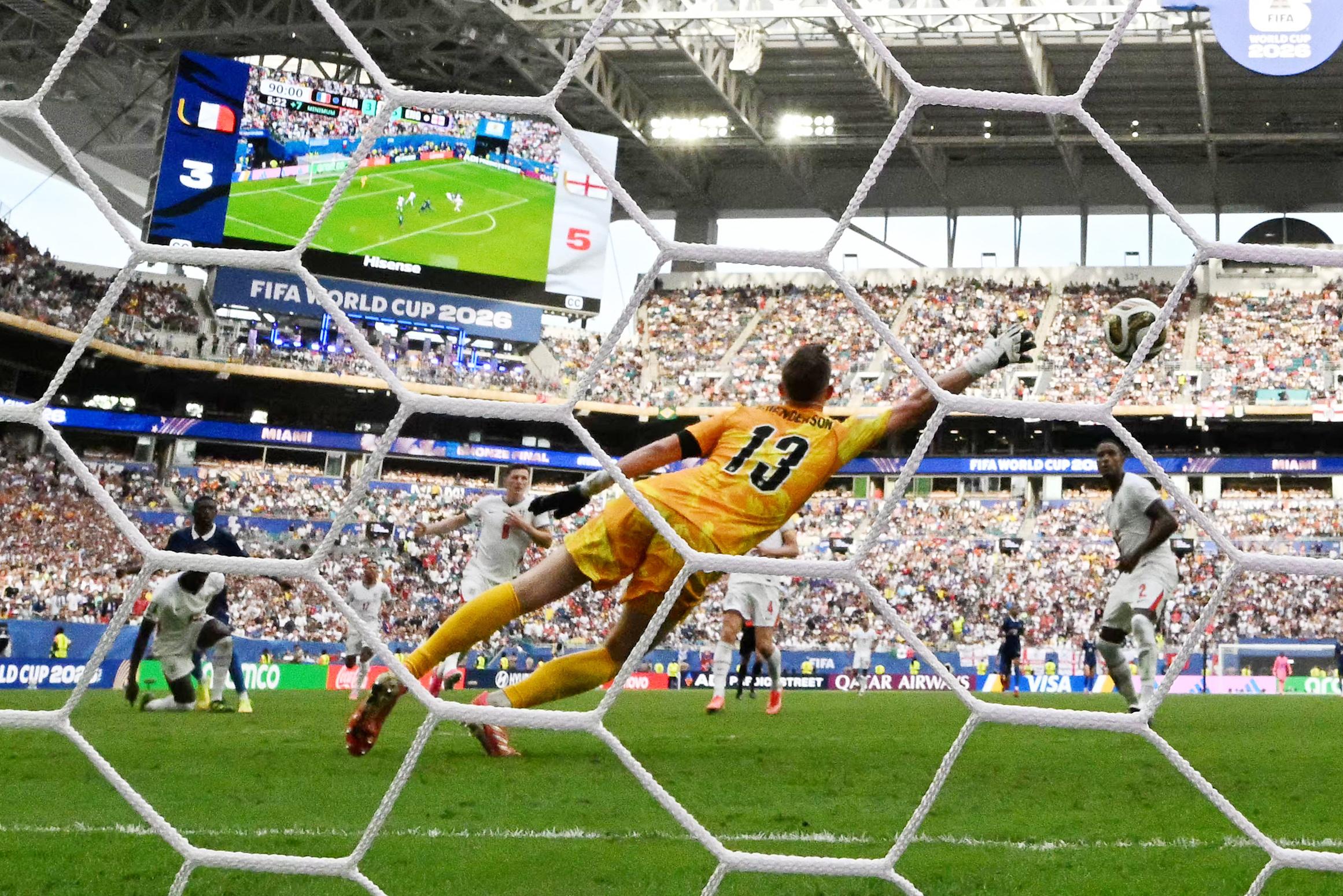 England's goalkeeper Dean Henderson concedes a goal scored by France's forward Ousmane Dembele and his team's fourth goal.