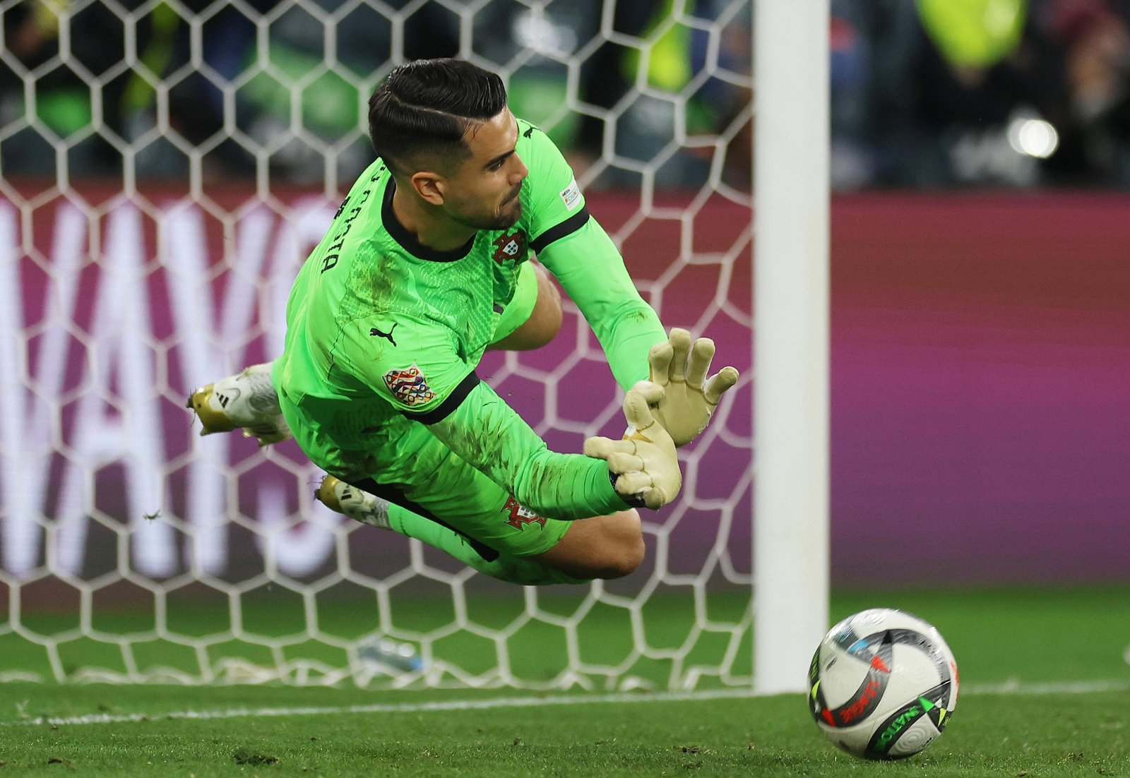 Diogo Costa of Portugal saves a penalty taken by Alvaro Morata of Spain.