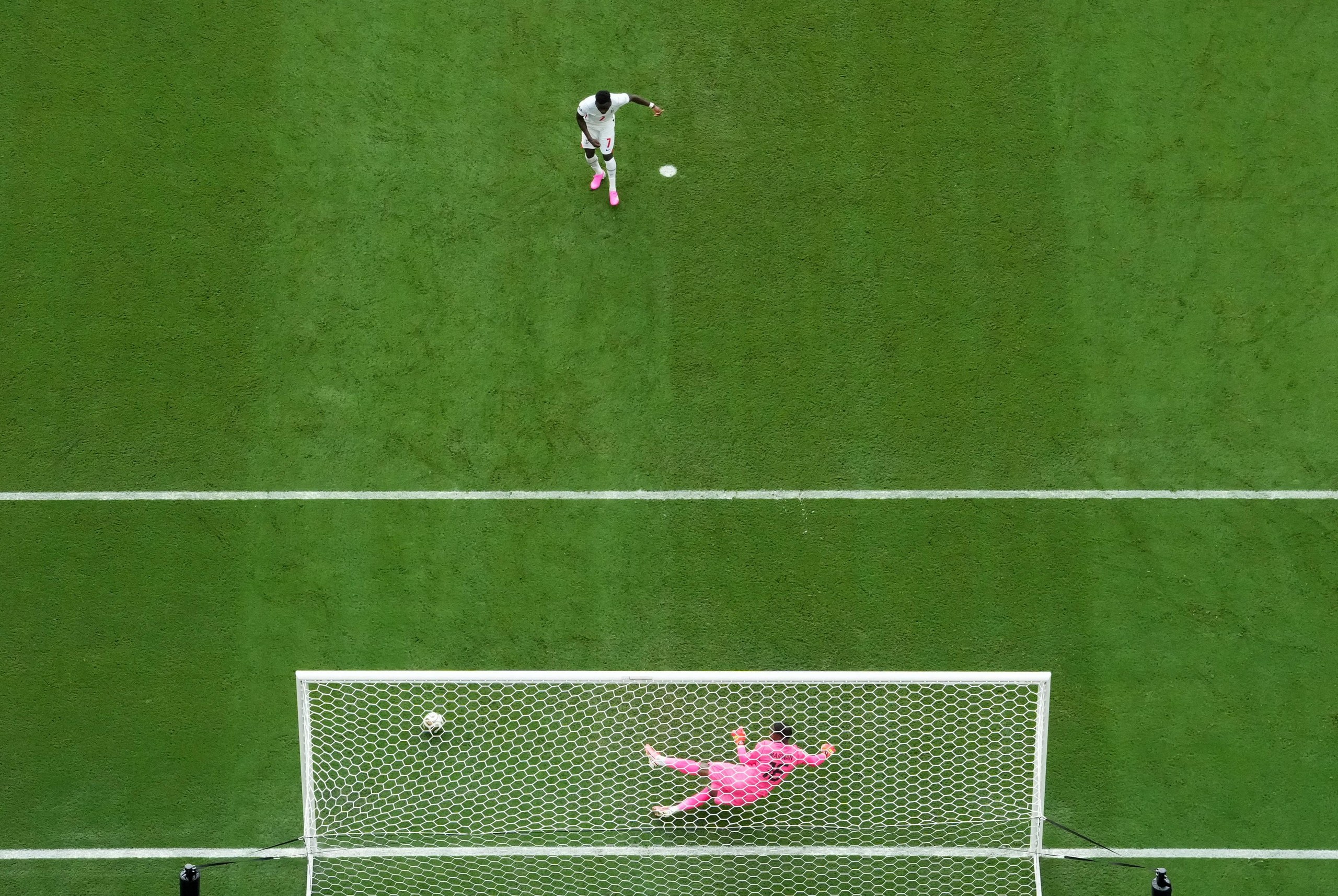 England's Bukayo Saka scores their fifth goal from the penalty spot.