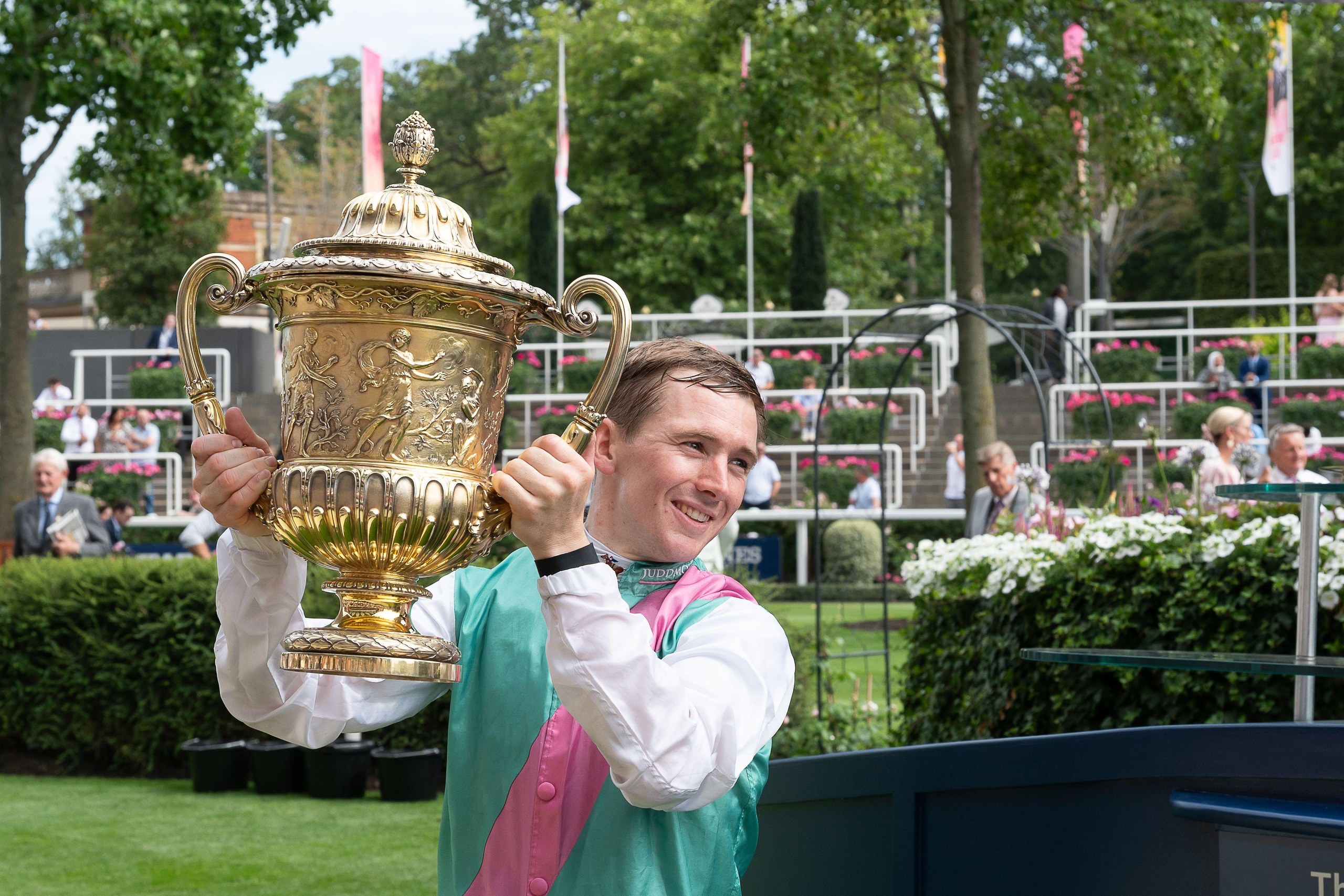 Winning jockey Colin Keane holds up the King George trophy after riding horse Kalpana to win the King George VI and Queen Elizabeth Stakes.