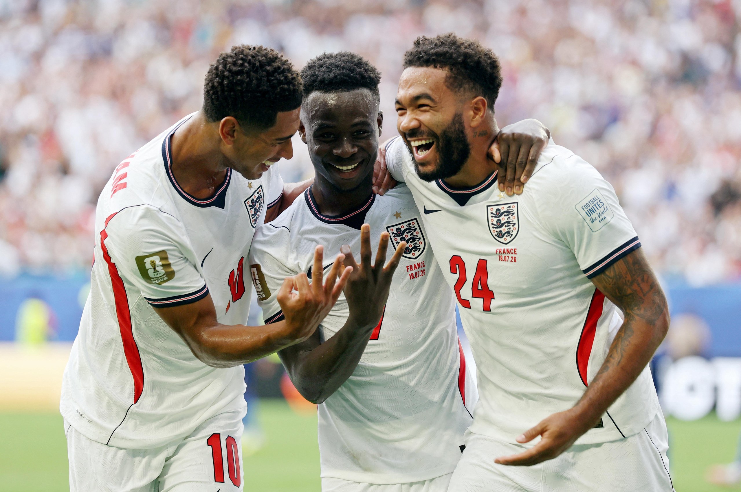 England's Bukayo Saka celebrates scoring their fifth goal to complete a hat-trick with Jude Bellingham and Reece James.