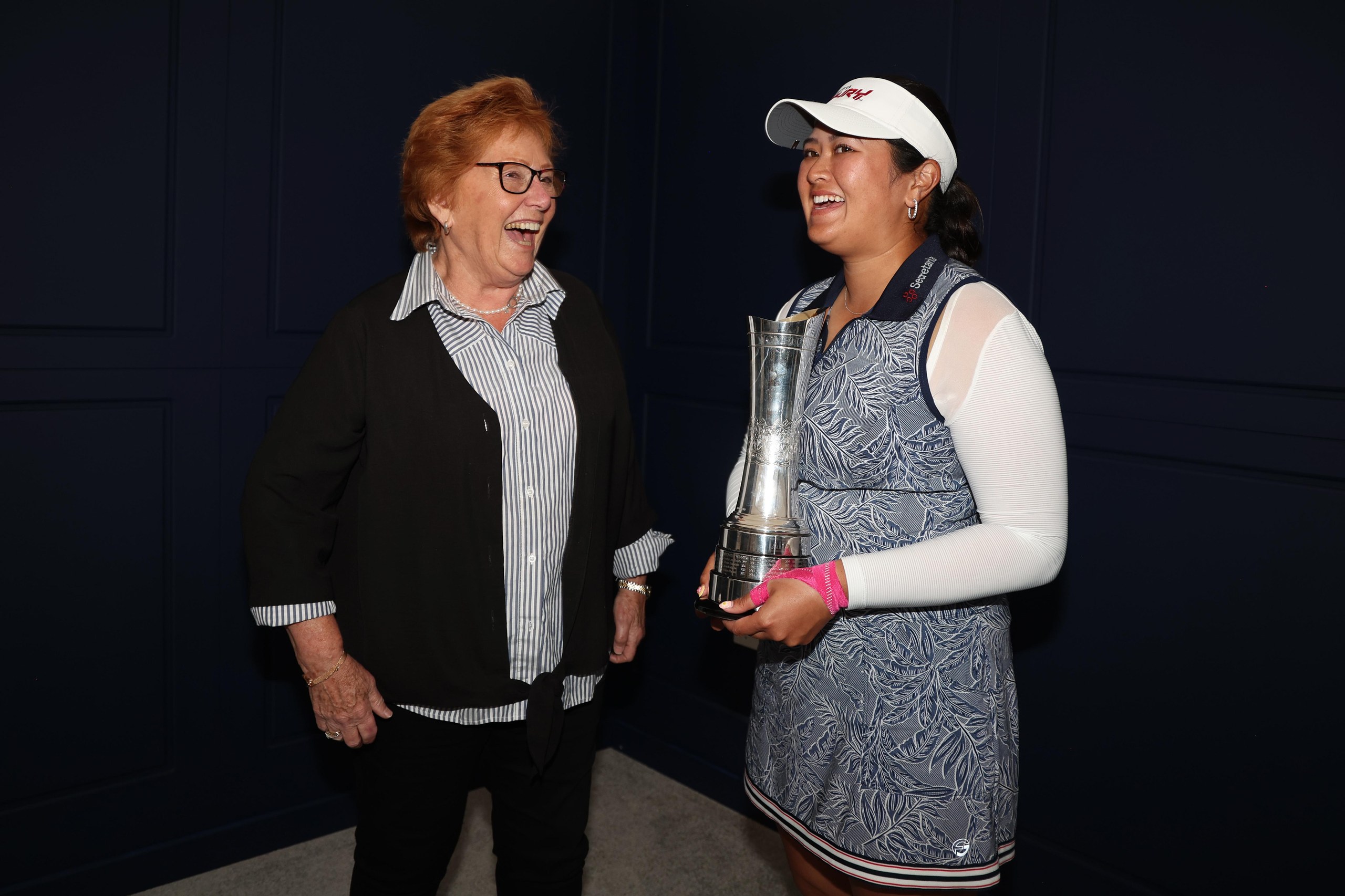 Jenny Lee Smith and Lilia Vu smile as the latter holds the Women’s Open trophy