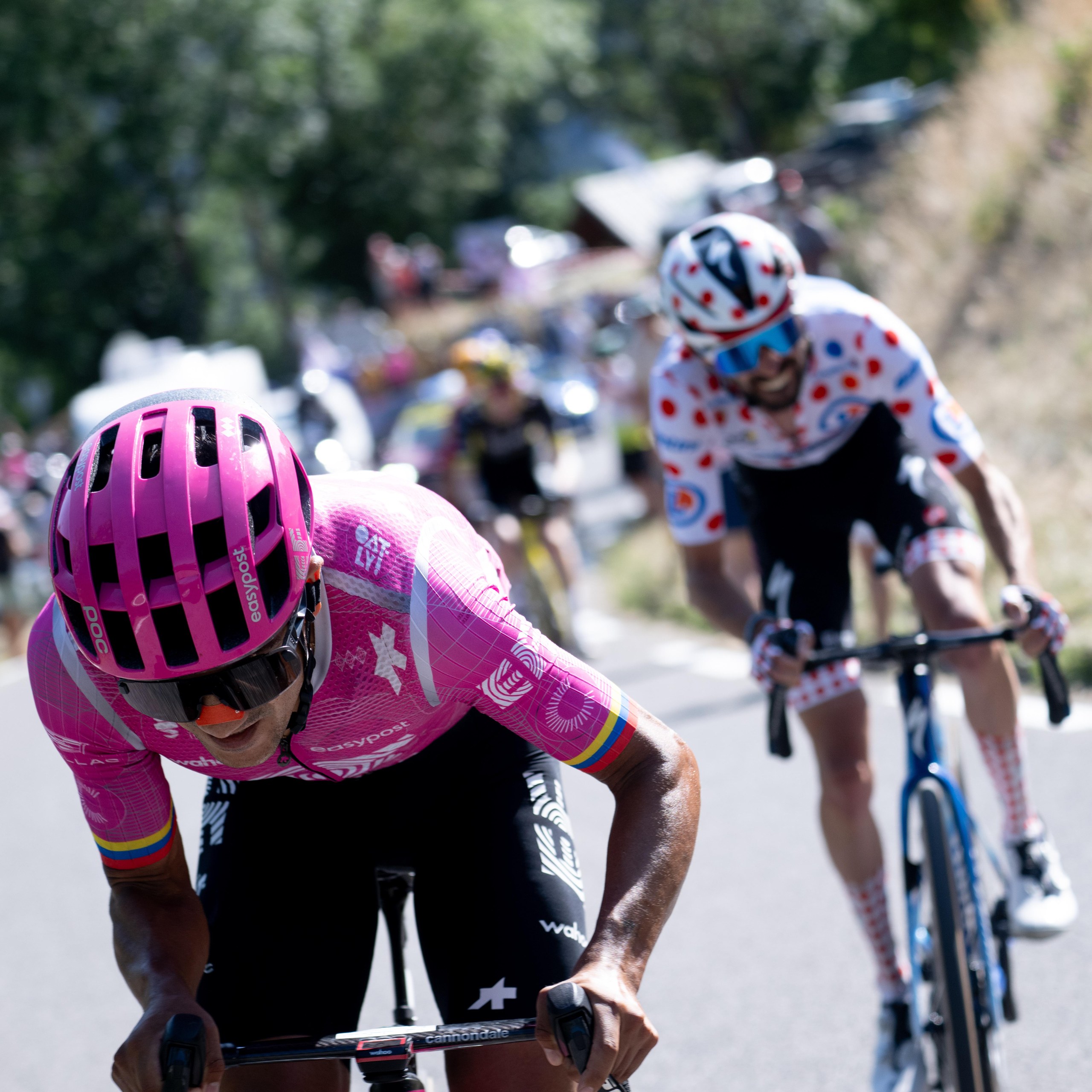 Richard Carapaz makes a break in front of Valentin Paret Peintre in the final kilometres of the stage.