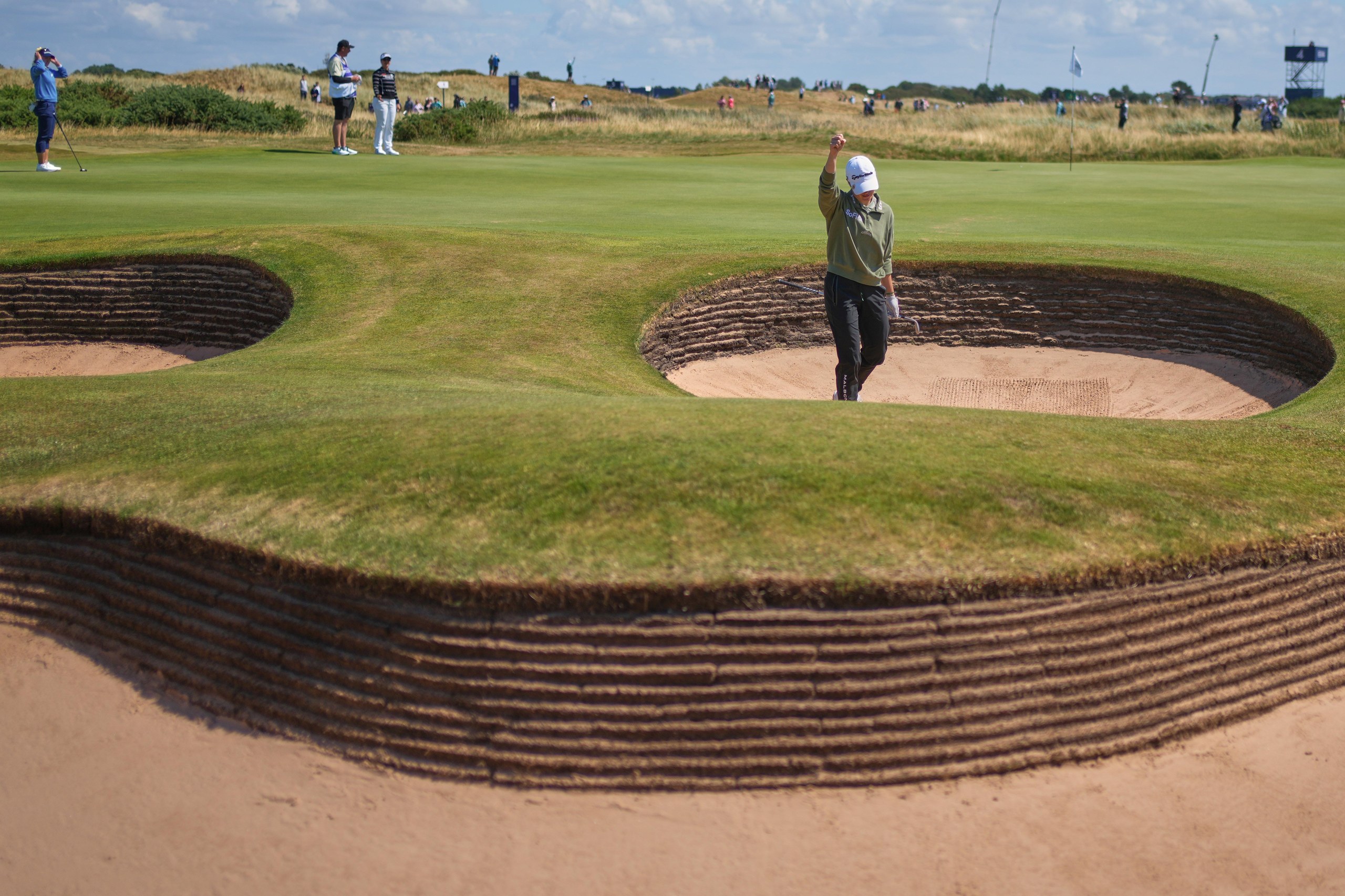 Charley Hull reacts after chipping in