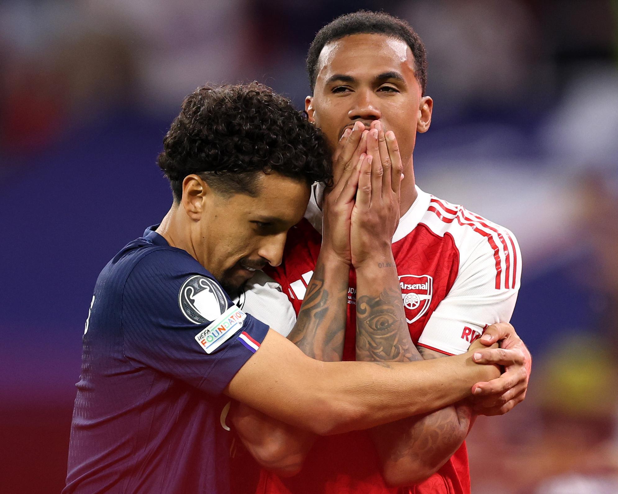 Arsenal’s Gabriel is consoled by Marquinhos of Paris Saint-Germain after he misses the team's fifth penalty