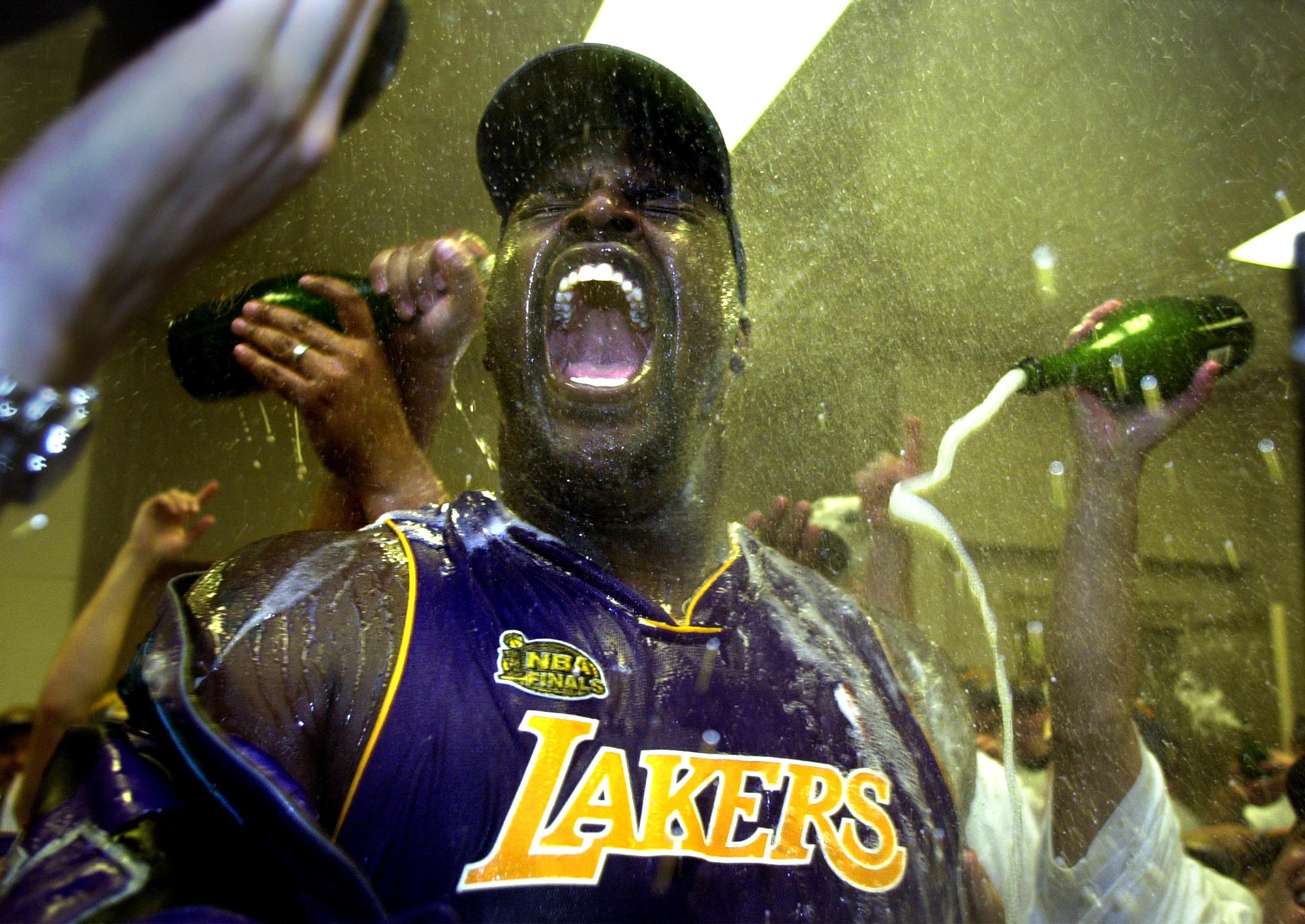 Shaquille O'Neal celebrates in the locker room after the Lakers won the 2001 NBA championship over the Philadelphia 76ers.