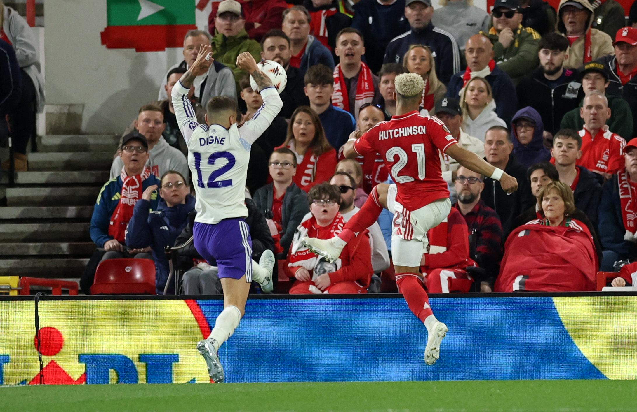 Aston Villa's Lucas Digne handballs to concede a penalty after Nottingham Forest's Omari Hutchinson crosses the ball.