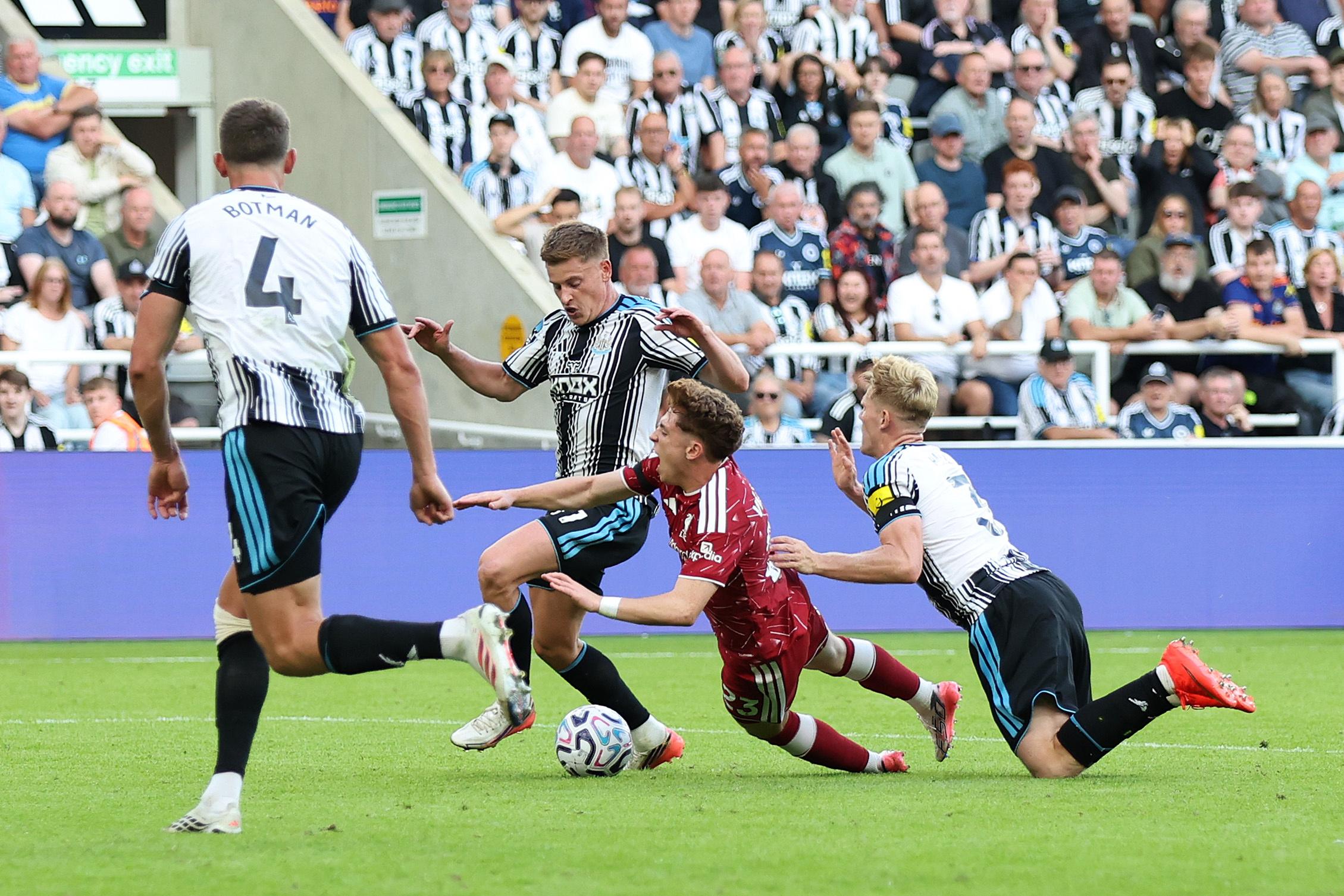 Victor Munoz of Liverpool is fouled by Lewis Hall of Newcastle United leading to a penalty.