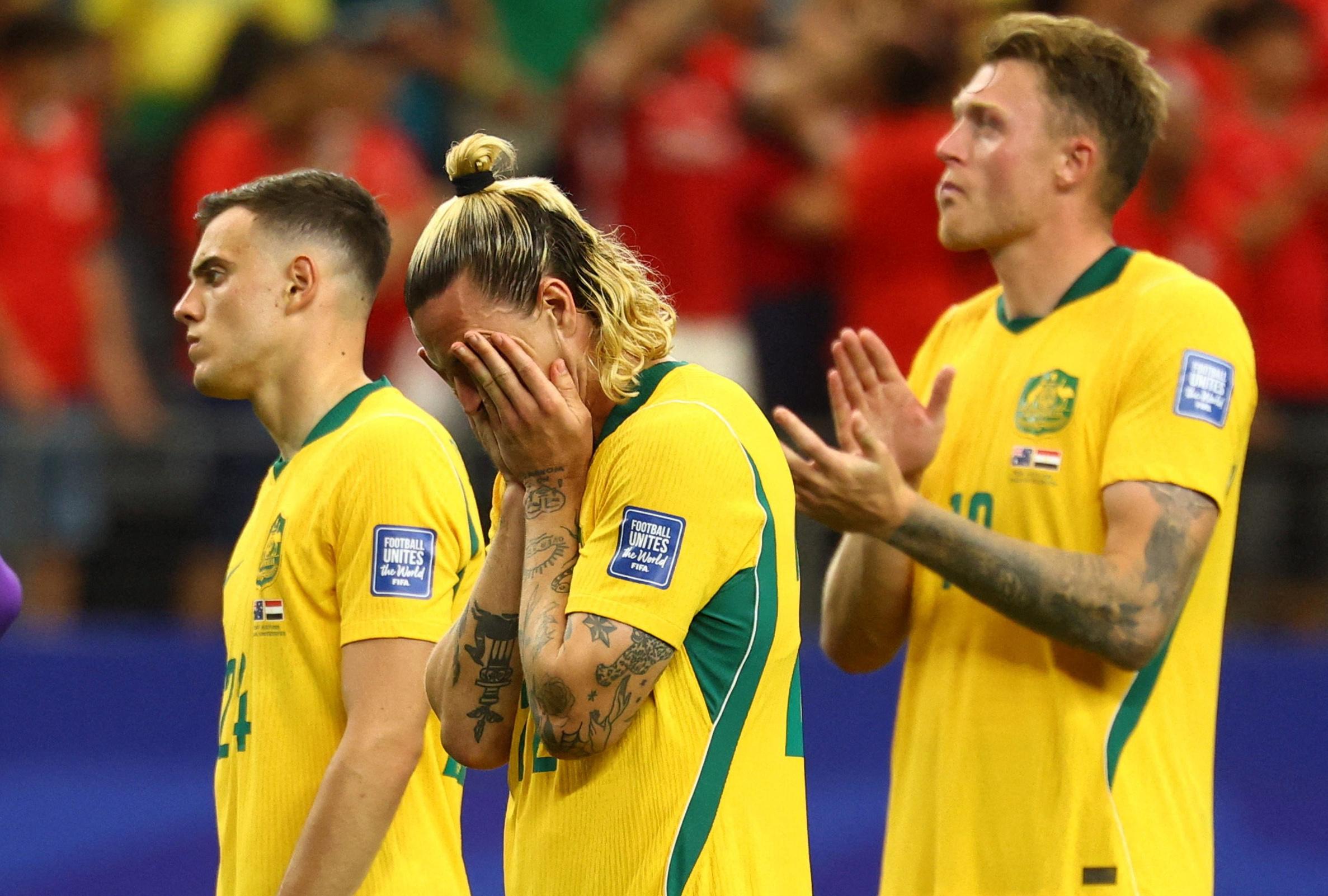 Australia’s Paul Okon Engstler, Jackson Irvine and Harry Souttar look dejected after their World Cup elimination by Egypt