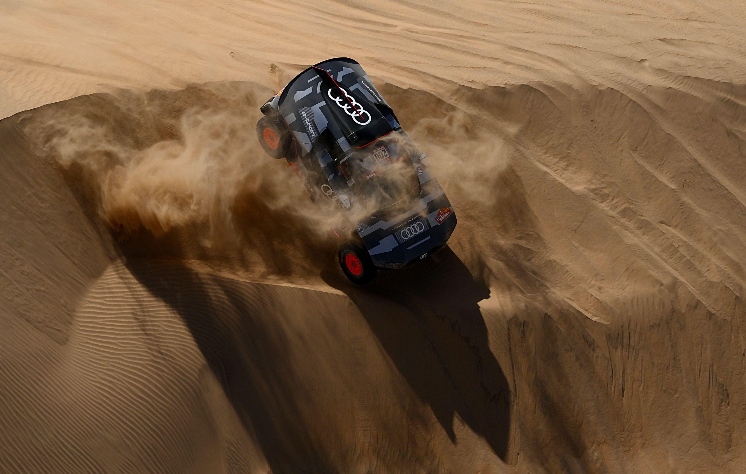 Audi’s driver Stephane Peterhansel and his co-driver Edouard Boulanger in their Audi RS Q E-Ttron compete during Stage 11.