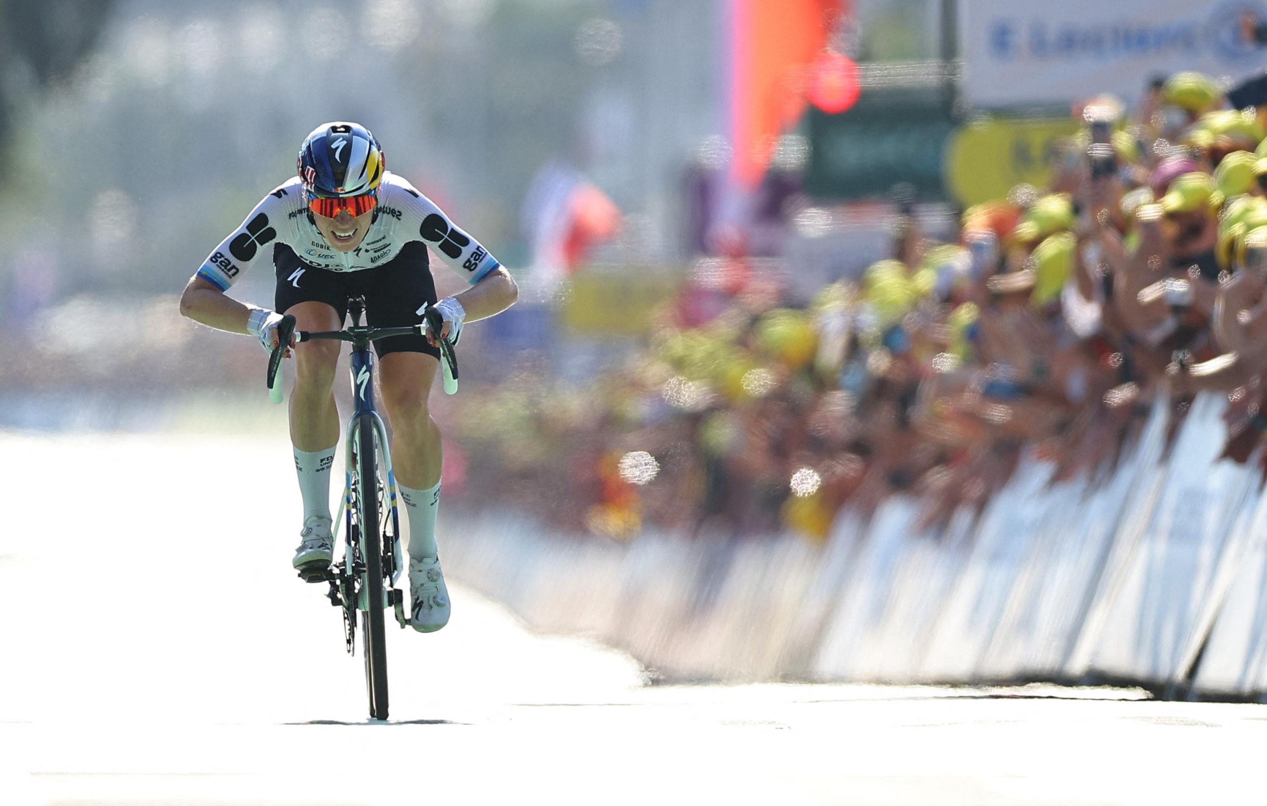 FDJ United-Suez’s Demi Vollering sprints towards the line to win the stage and claim the yellow jersey.