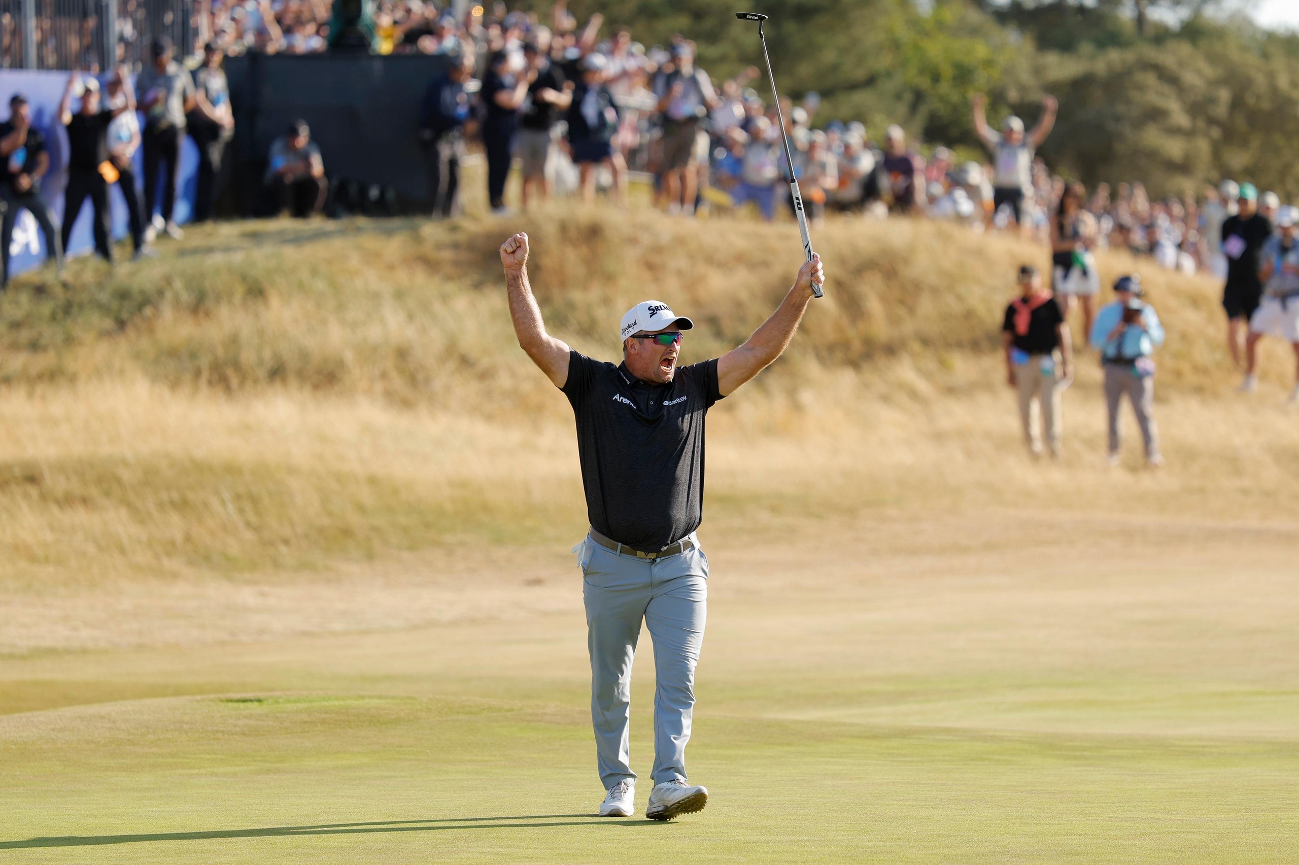 Ryan Fox celebrates victory on the 18th green.