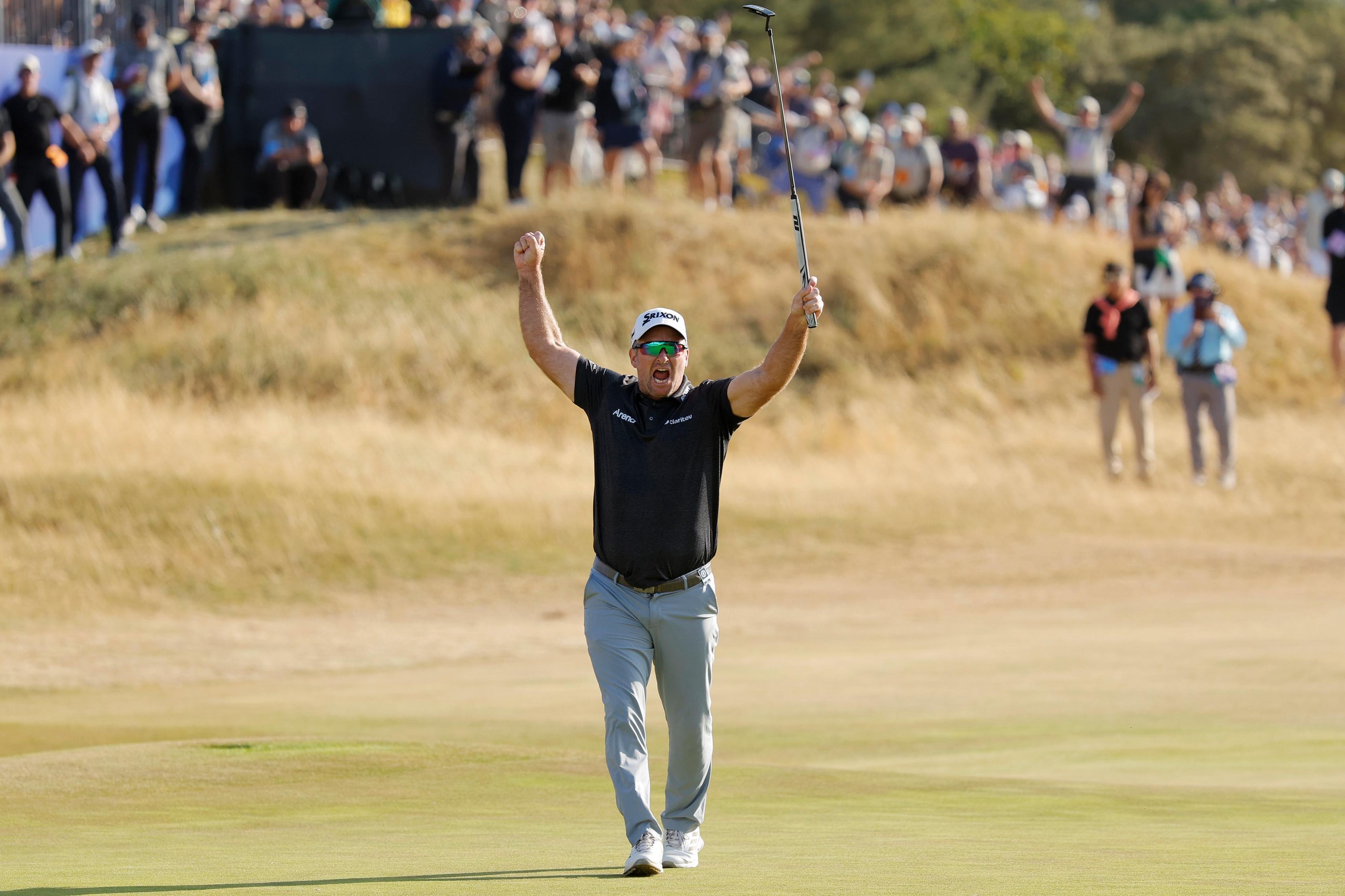Ryan Fox celebrates his putt going in to win the Open
