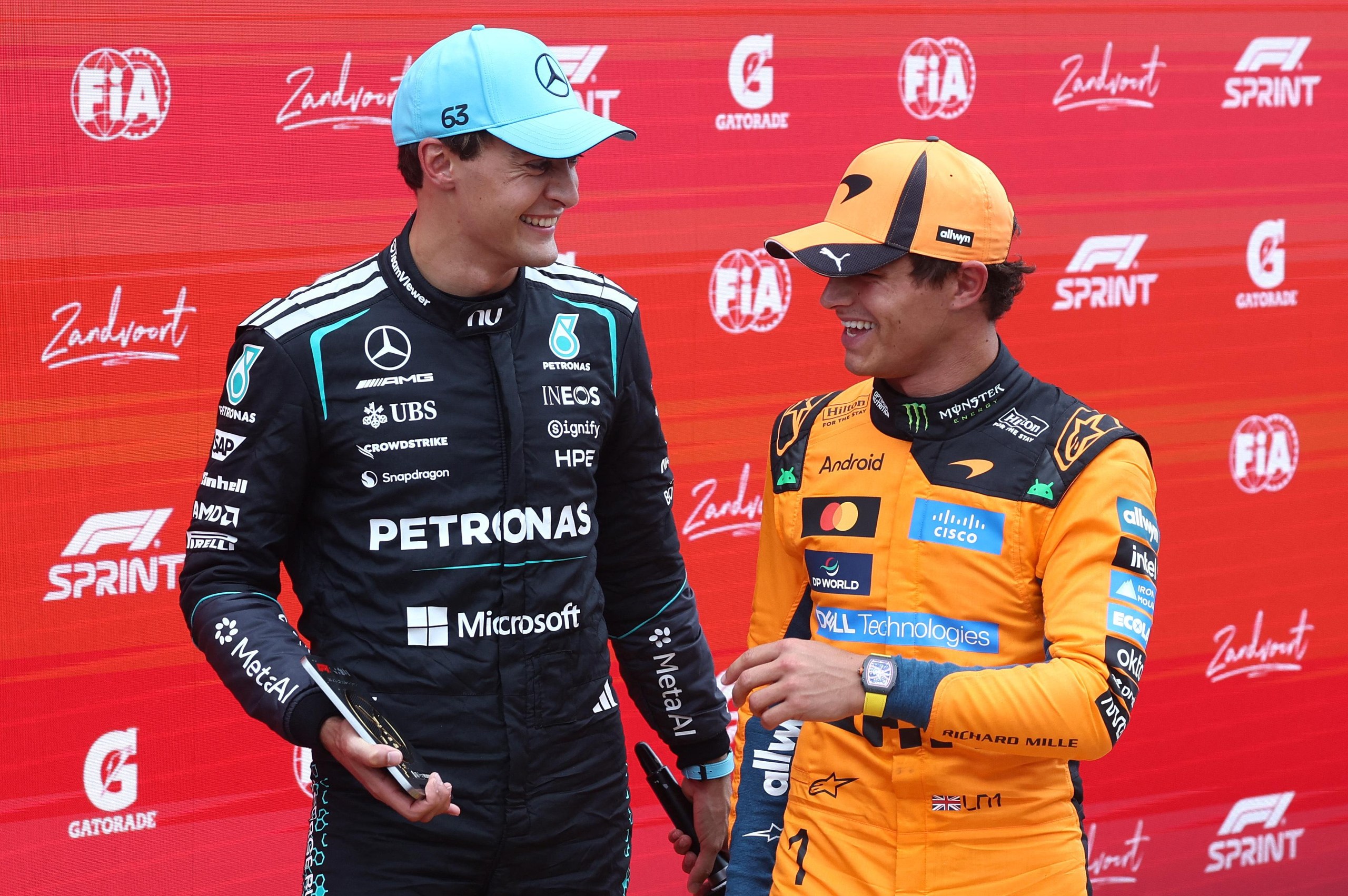 Mercedes’ George Russell celebrates winning the sprint race with McLaren’s Lando Norris