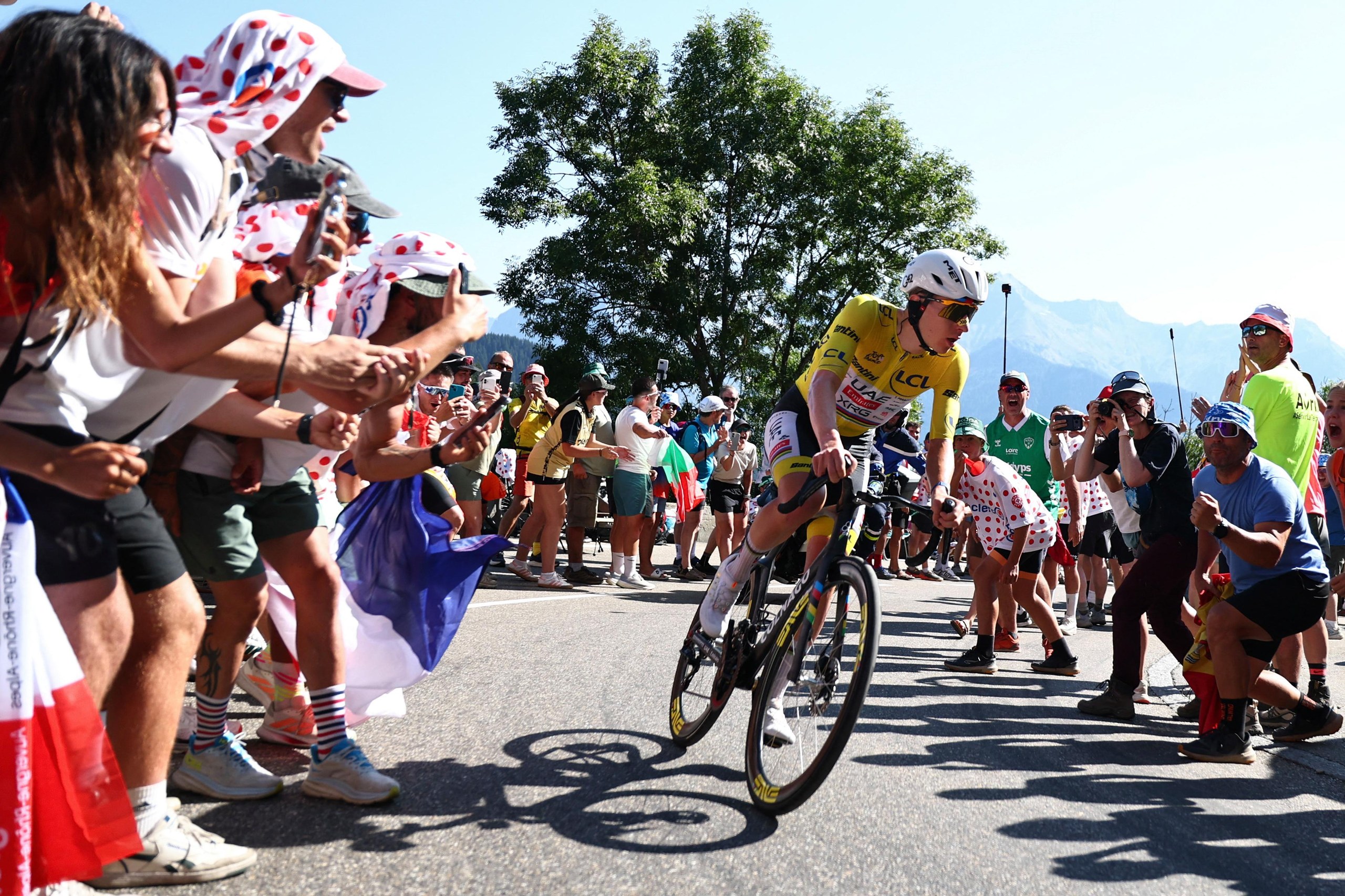 Tadej Pogacar chases down the lead breakaway group on the Alpe d’Huez ascent