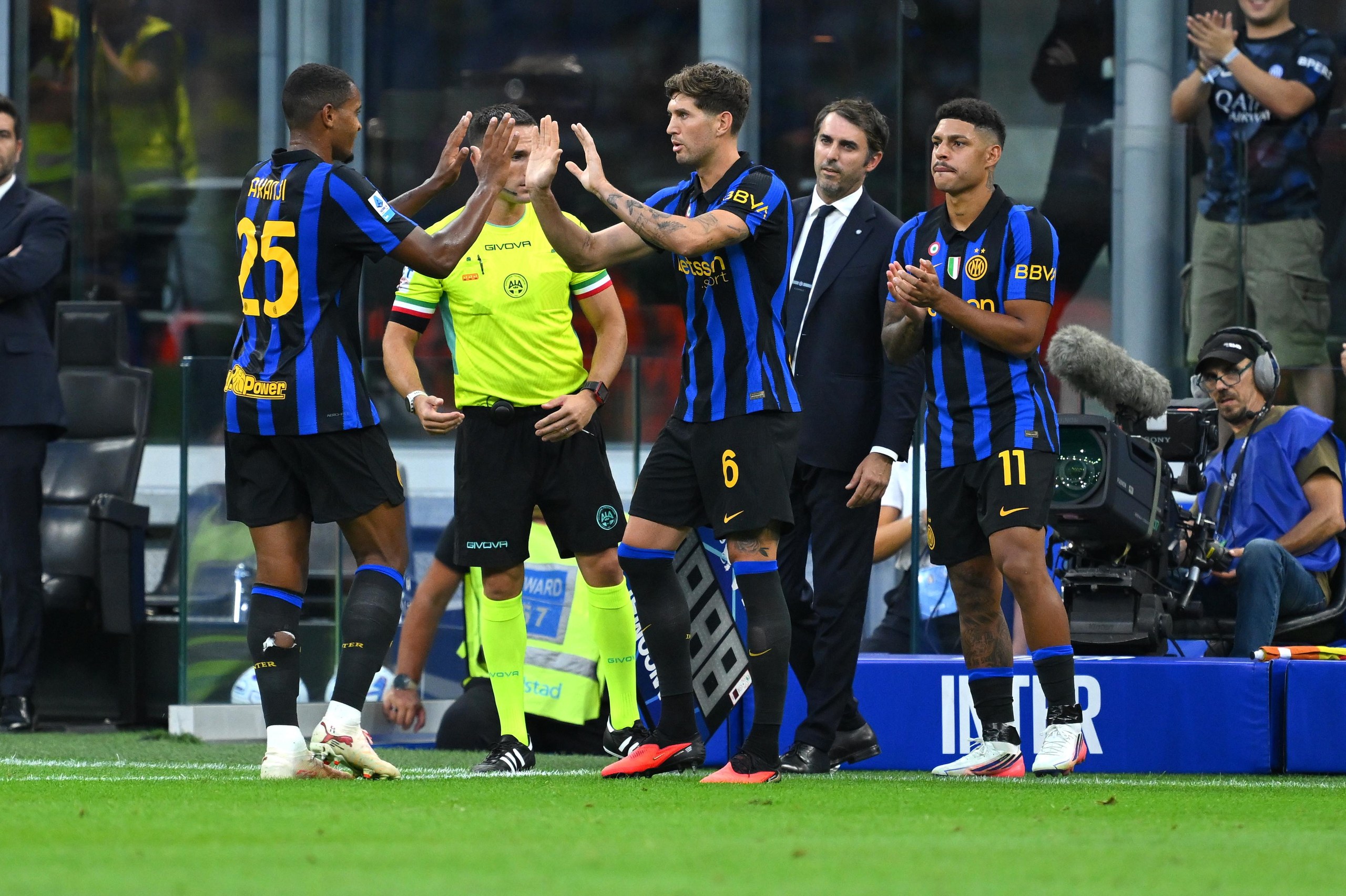 John Stones (right) makes his debut for Inter.