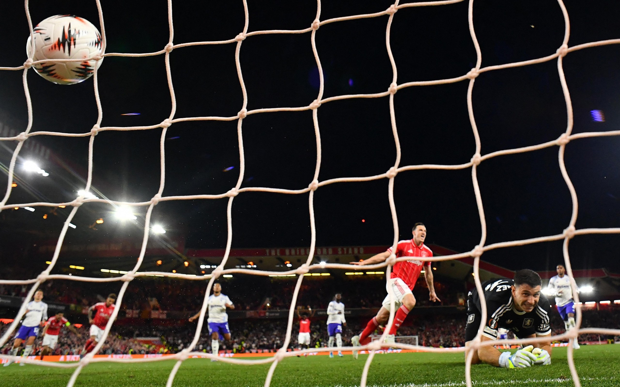 Nottingham Forest's Chris Wood celebrates scoring their first goal past Aston Villa's keeper Emiliano Martinez from the penalty spot.