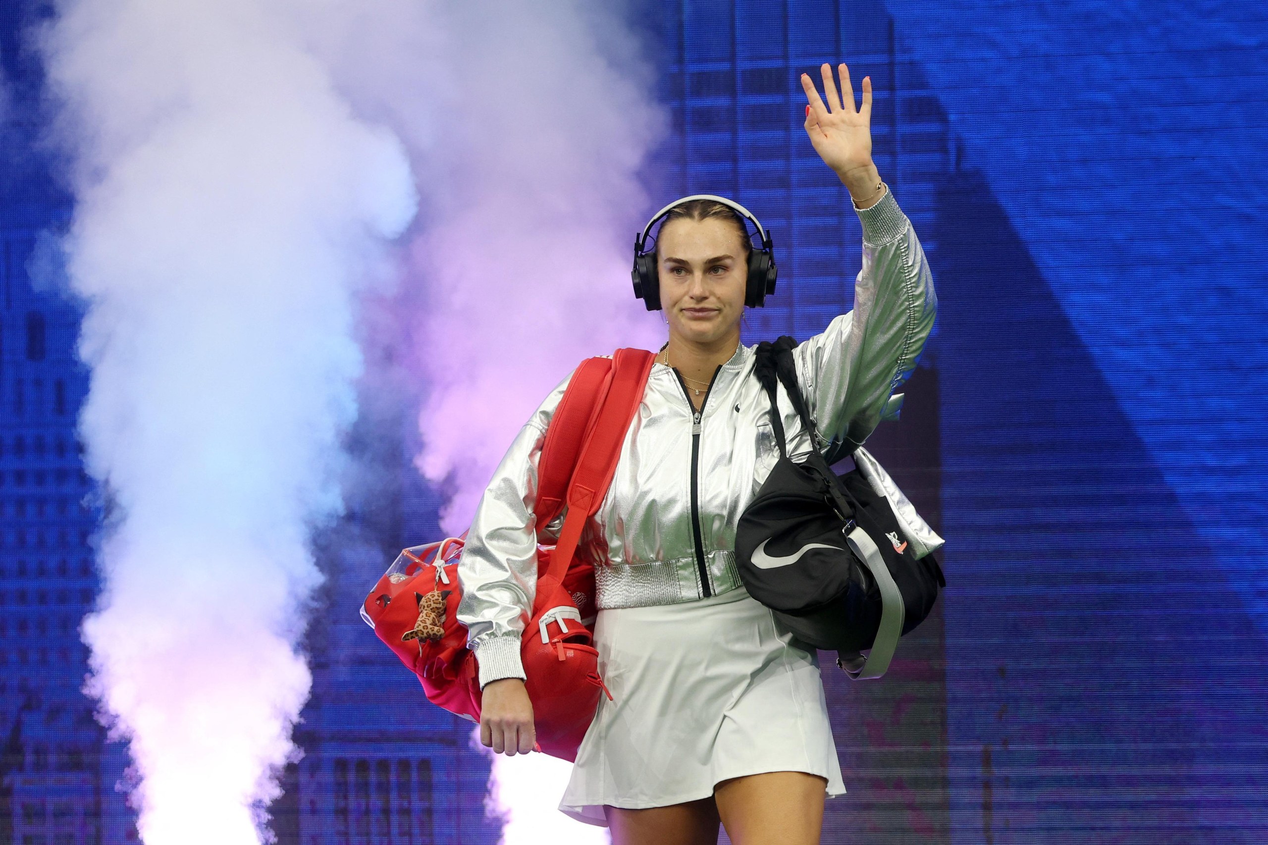 Aryna Sabalenka walks onto the court