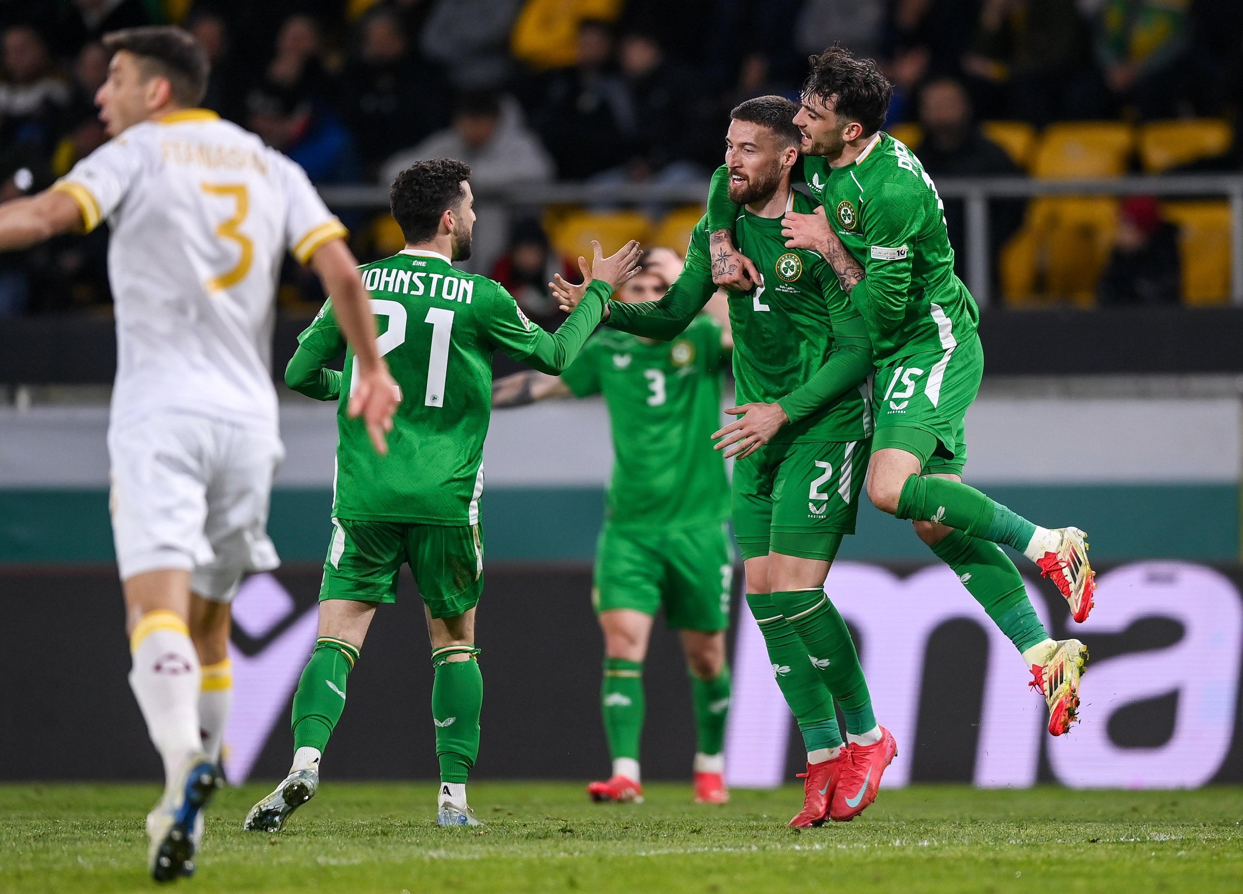 Matt Doherty of Republic of Ireland celebrates with teammates Troy Parrott, right, and Mikey Johnston after scoring their side's second goal.
