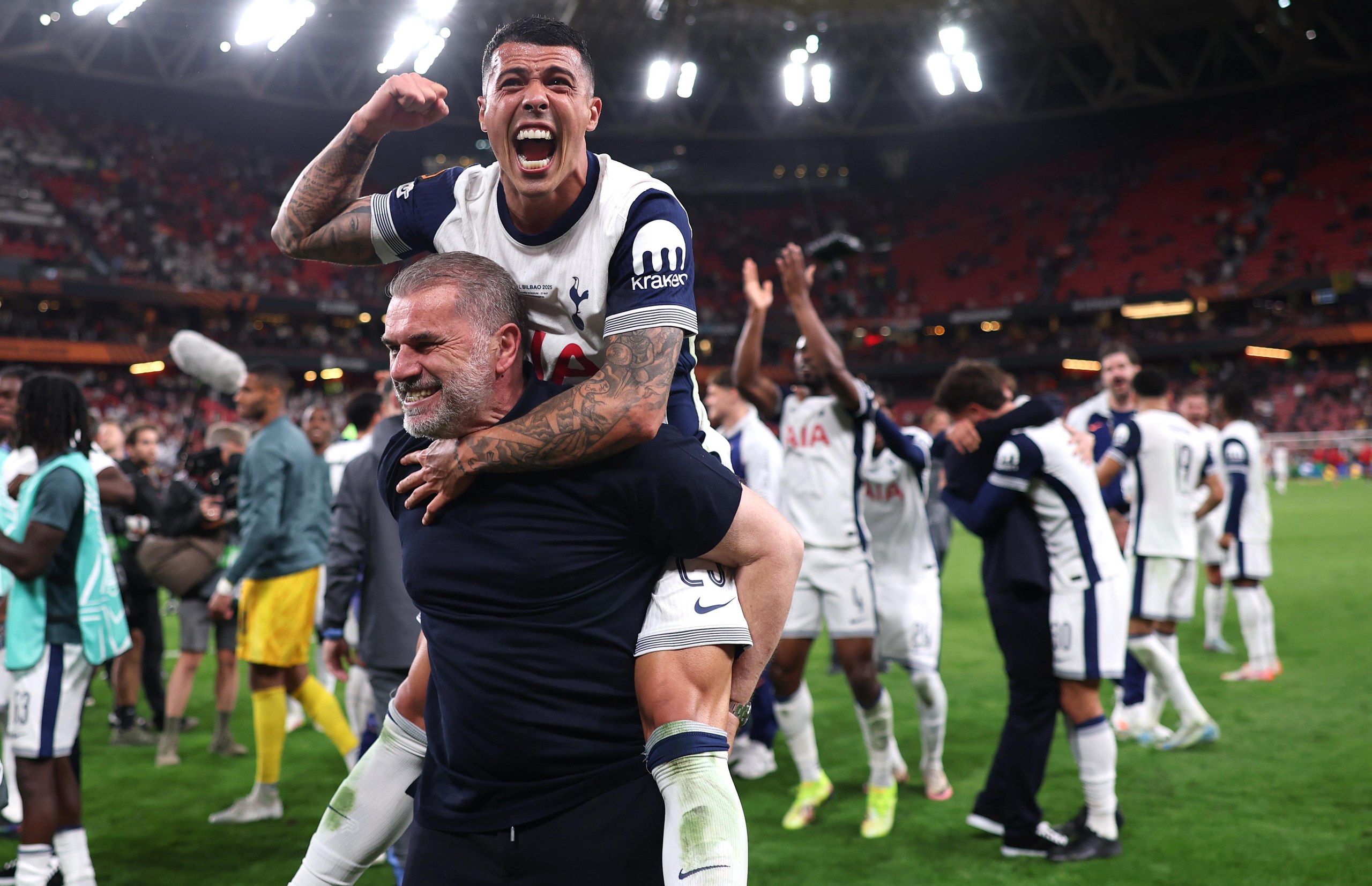 Ange Postecoglou gives Porro a piggyback at San Mamés after their Europa League triumph