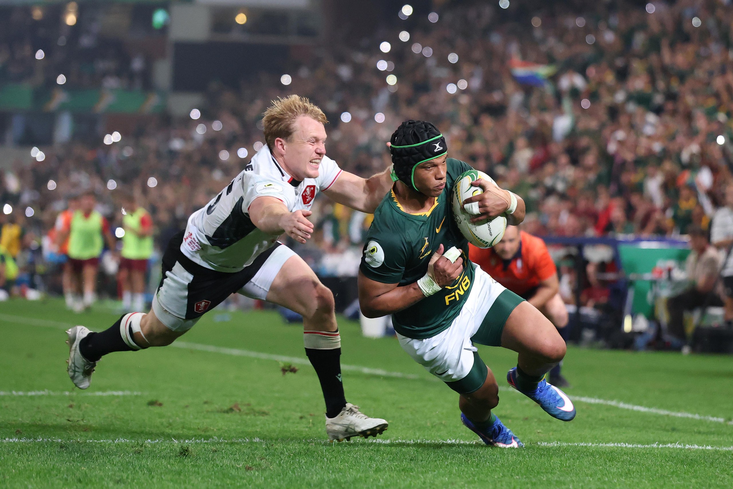 Kurt-Lee Arendse goes past Blair Murray of Wales for the sixth try