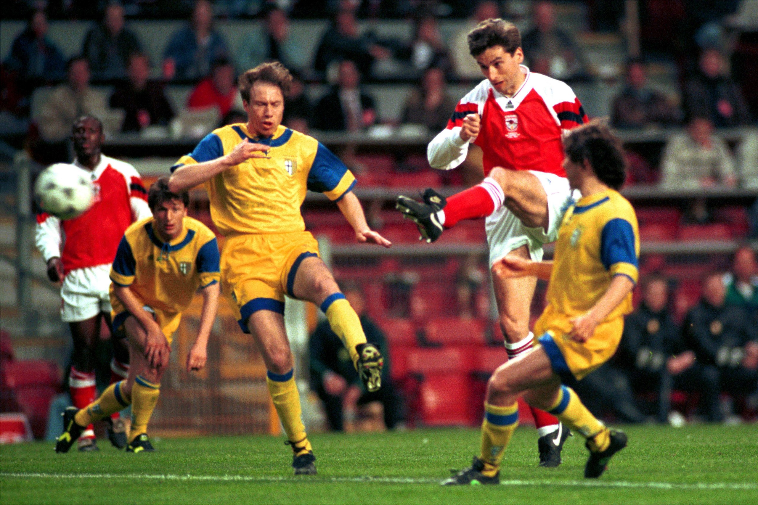 Arsenal’s Alan Smith scores against Parma.