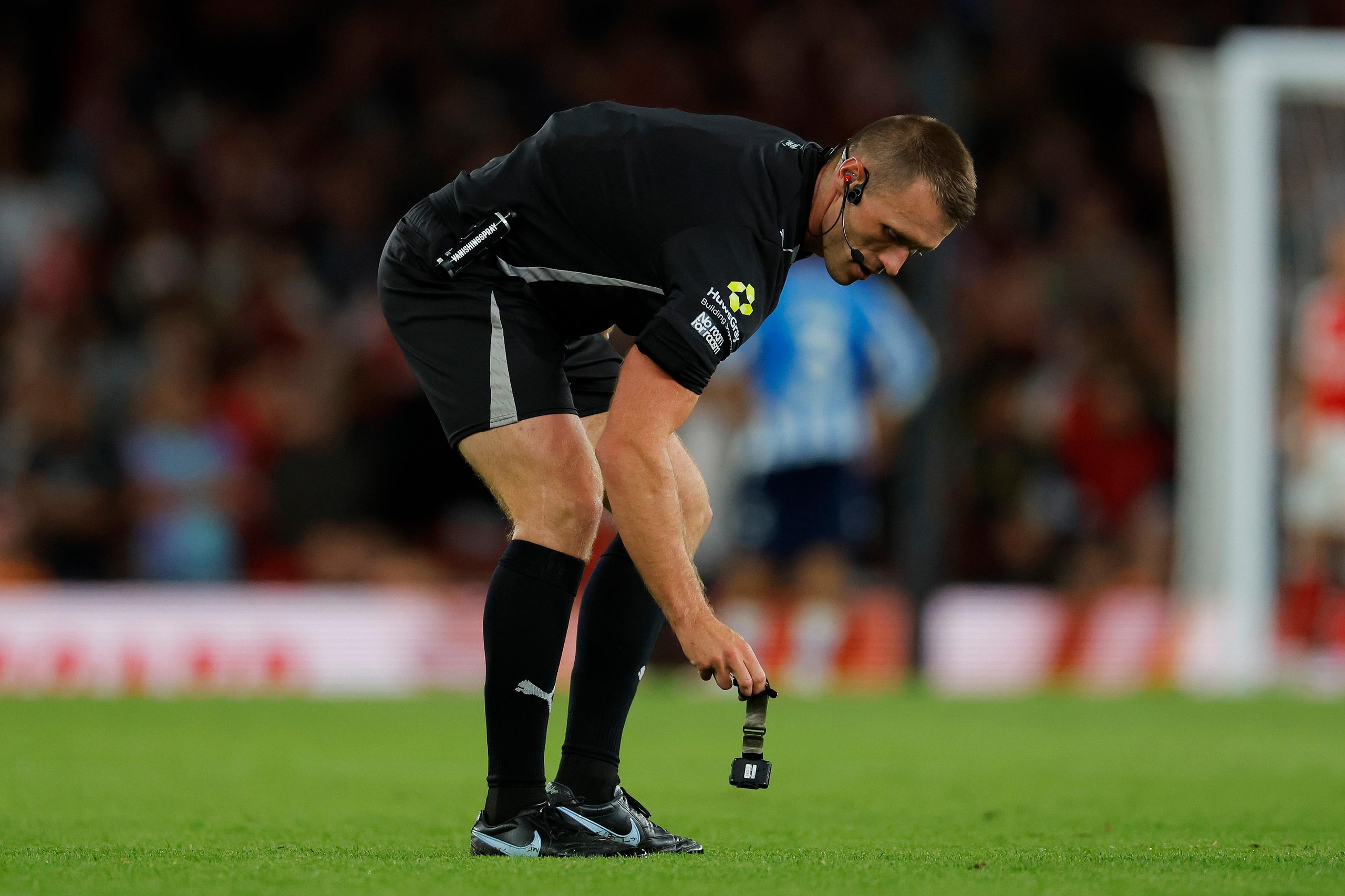 Referee Thomas Bramall drops his watch.