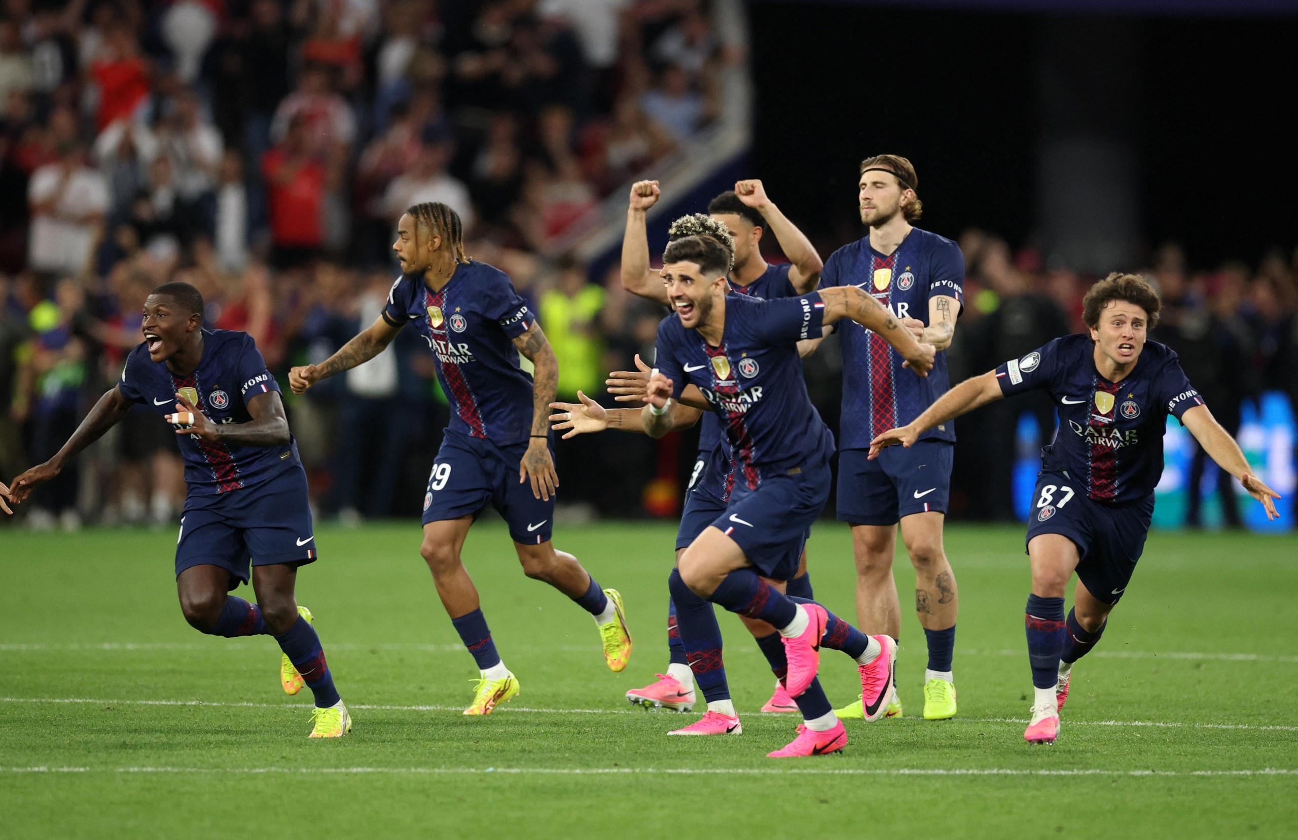 Paris St Germain players celebrate winning the Champions League.