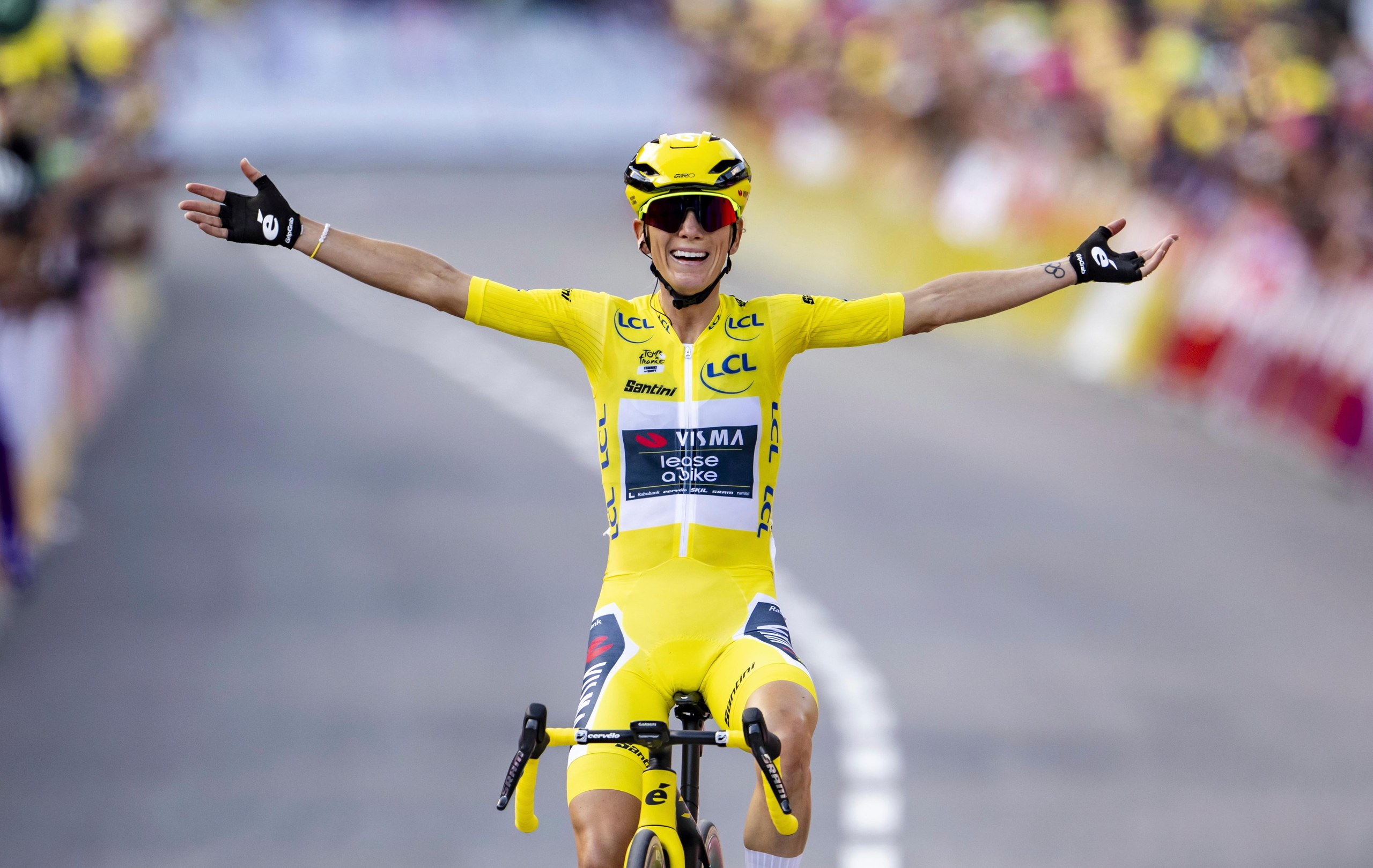 The winner of the Tour de France Femmes Pauline Ferrand-Prevot from France of team Visma - Lease a Bike celebrates as she crosses the finish line to win the 9th stage of the 4th edition of the Women’s Tour de France cycling race