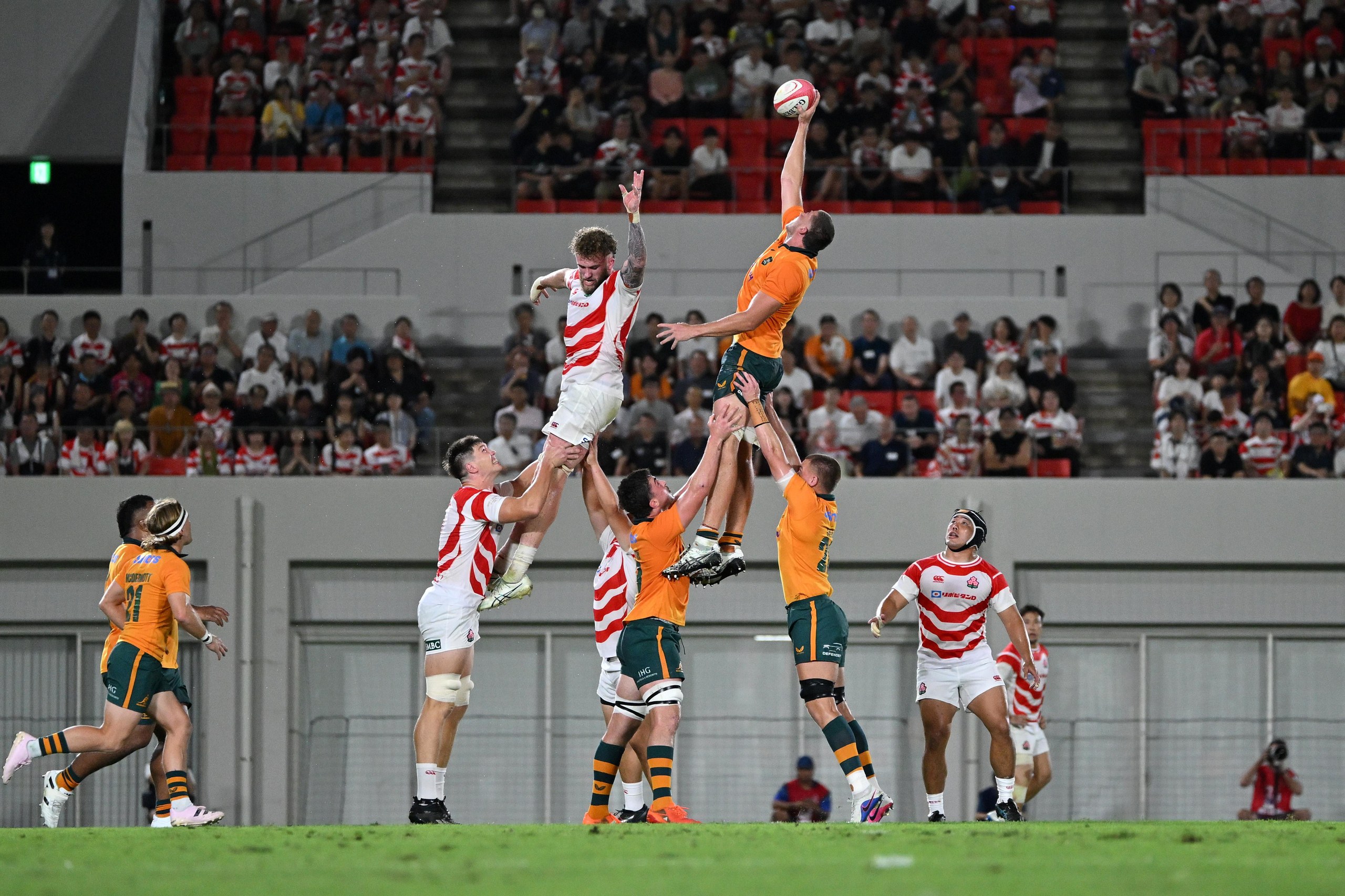 Australia’s Josh Canham flies high to win a line out at Hanazono Rugby Stadium on Saturday night.