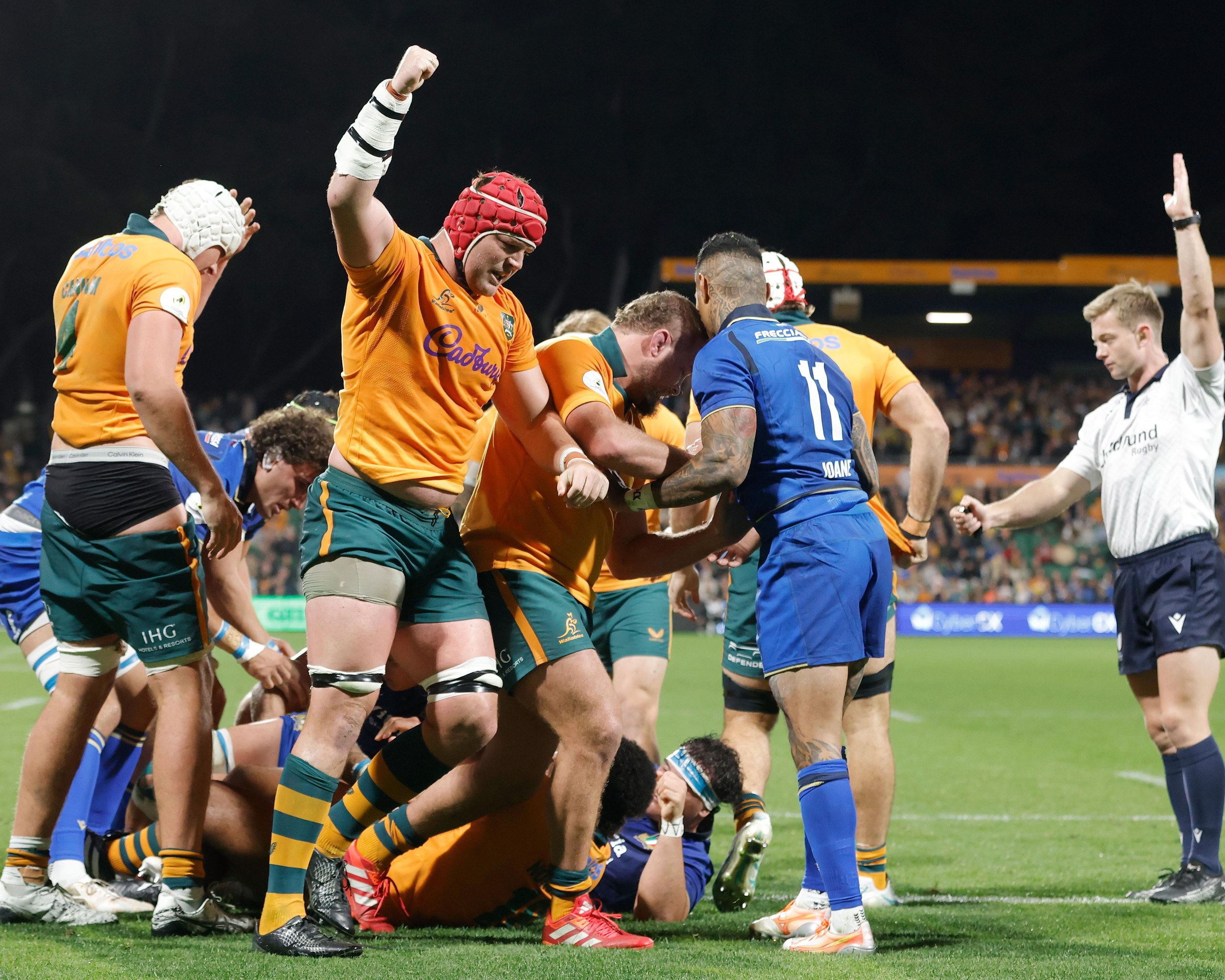 The Wallabies celebrate a try to Billy Pollard against Italy at HBF Park