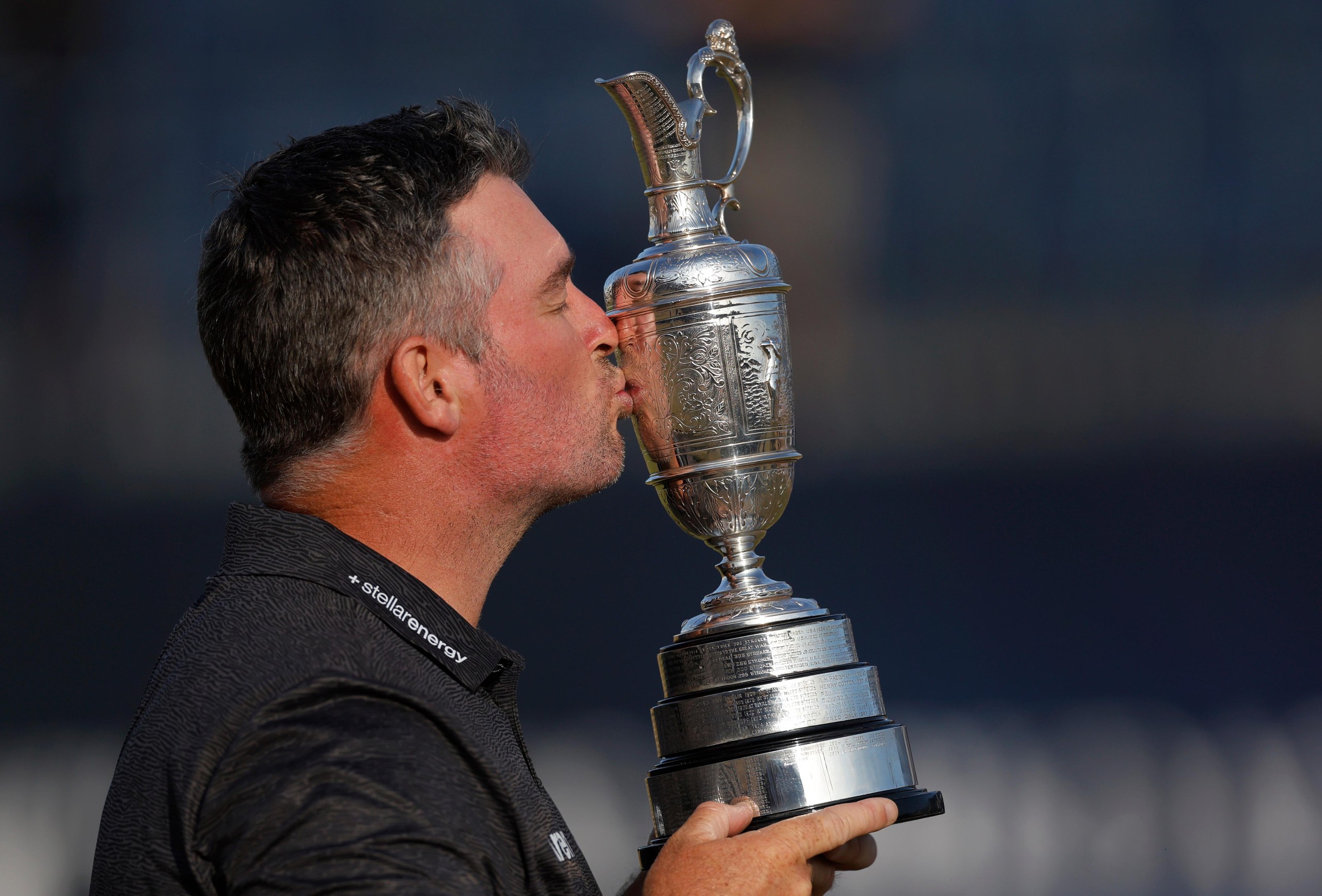 Ryan Fox kisses the trophy after his victory