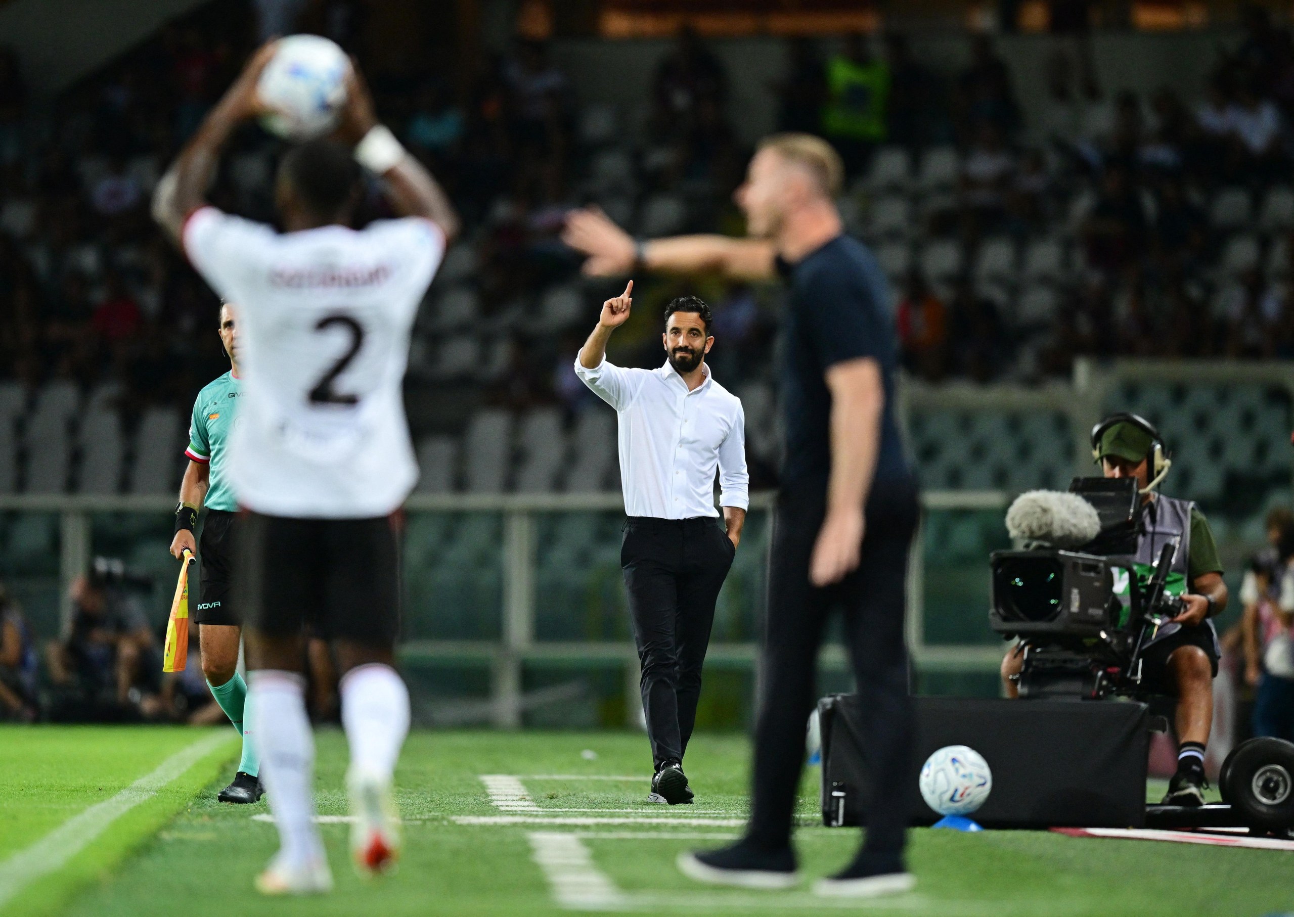 Ruben Amorim points on the touchline.