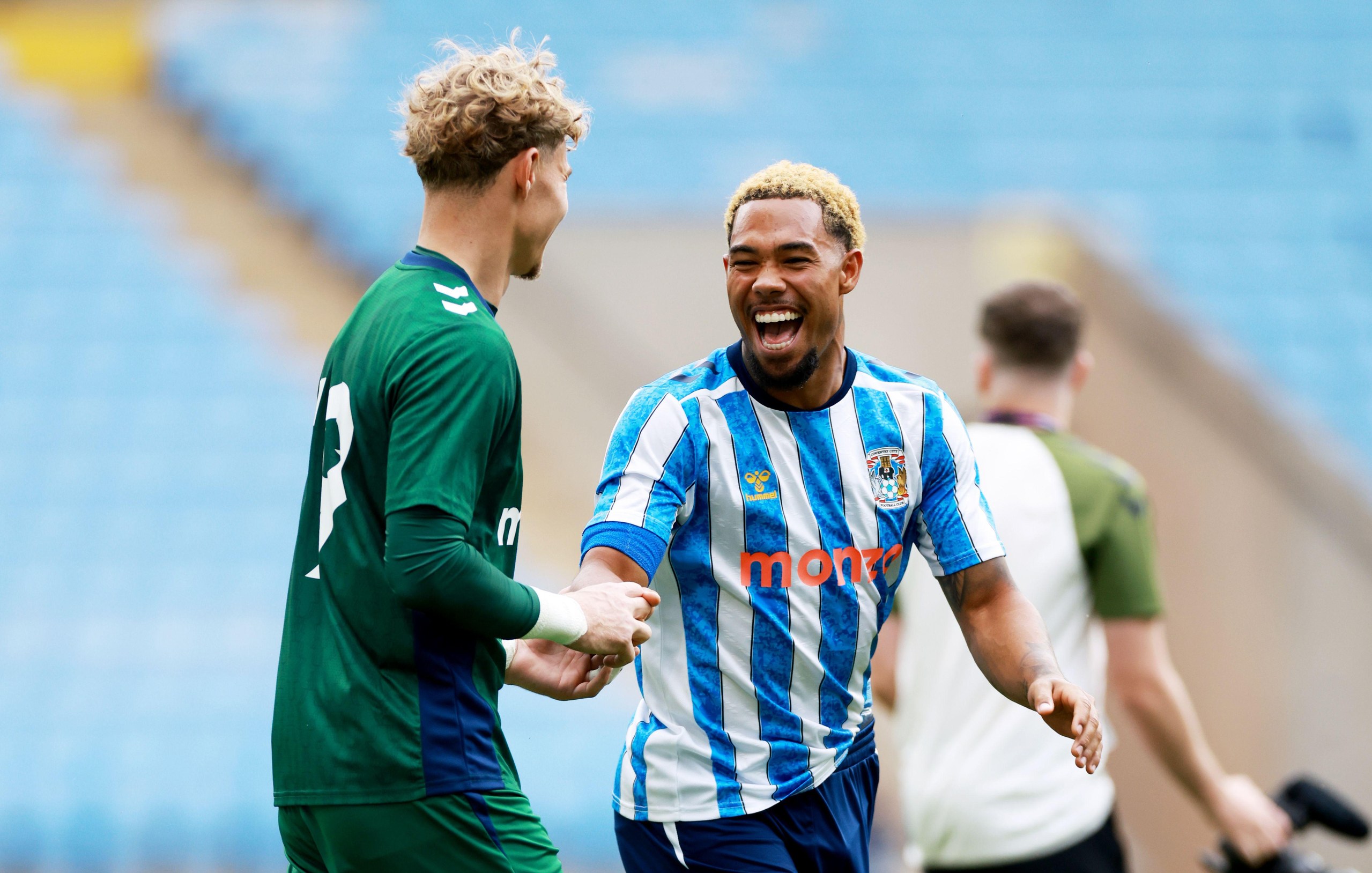 Milan van Ewijk shares a joke with Carl Rushworth in a friendly