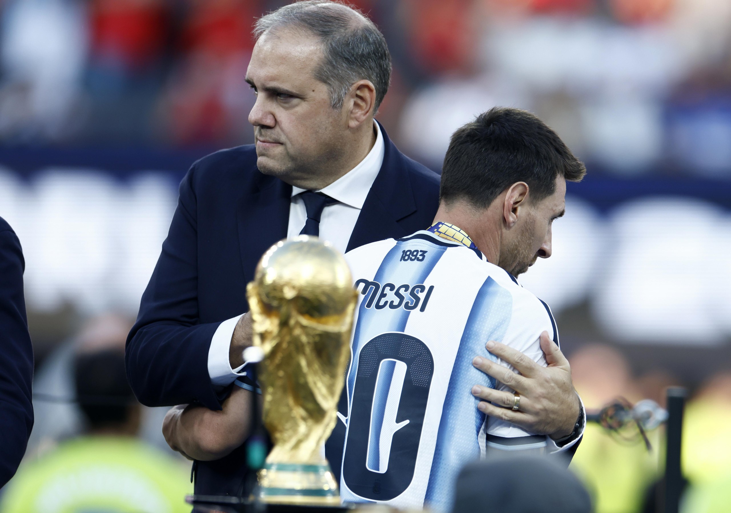 Lionel Messi of Argentina (right) interacts with Victor Montagliani, president of Concacaf, during the awards ceremony after the World Cup 2026 final