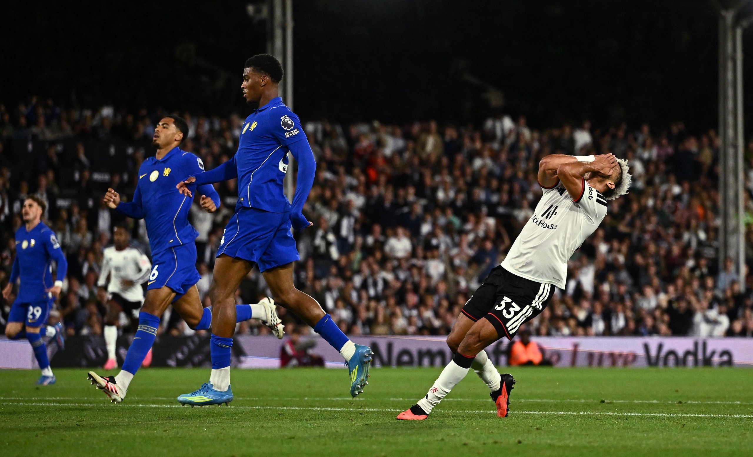 Fulham's Antonee Robinson reacts to his miss.