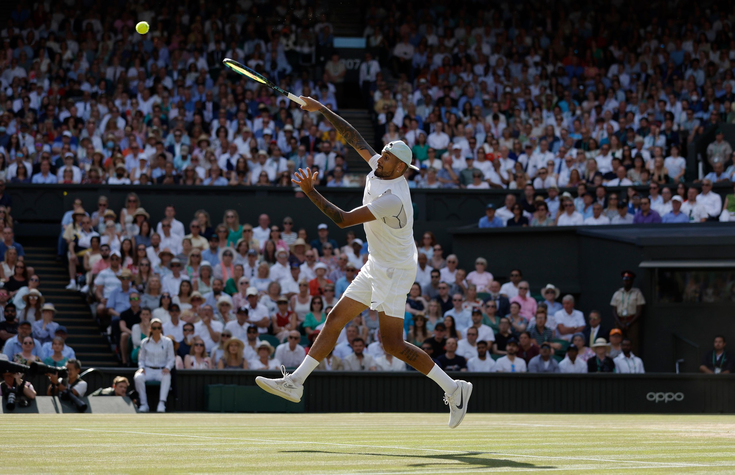 Nick Kyrgios smashes against Novak Djokovic in the Wimbledon men’s singles final in 2022