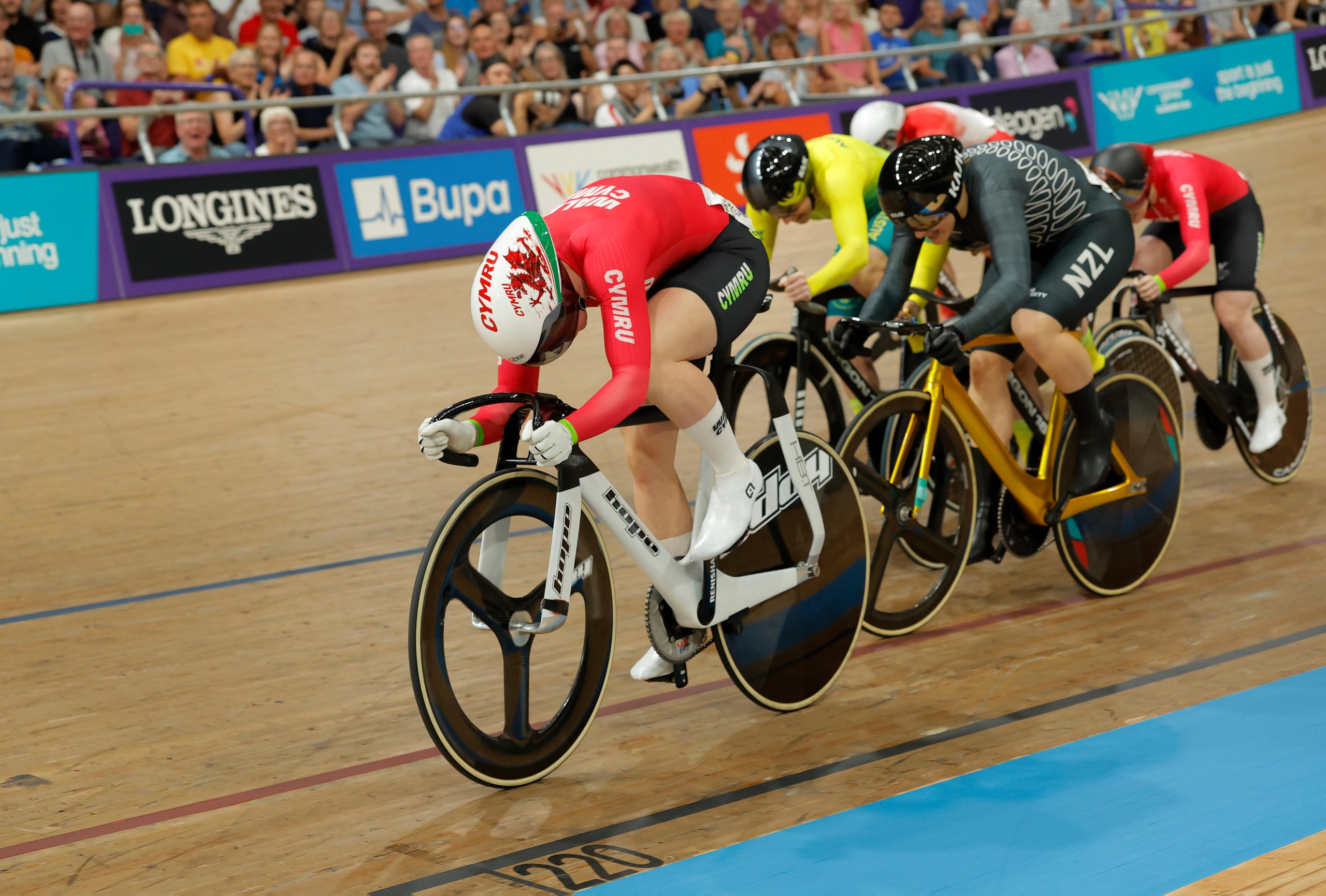 Emma Finucane of Wales sprints down the home straight to win the women's keirin final.