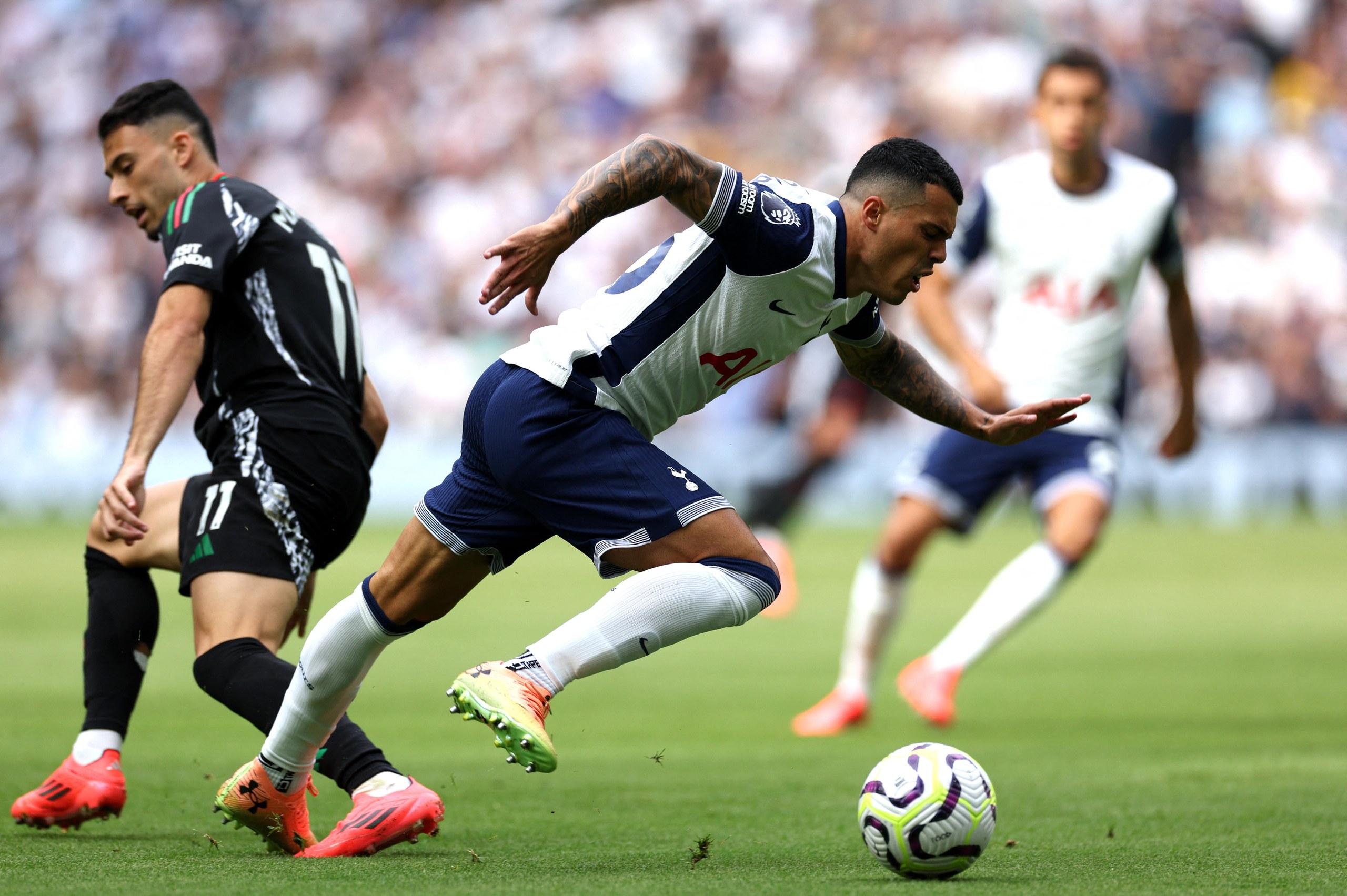 Pedro Porro takes the ball away from Gabriel Martinelli during last season’s north London derby at the Tottenham Hotspur Stadium. The hosts lost the game 1-0