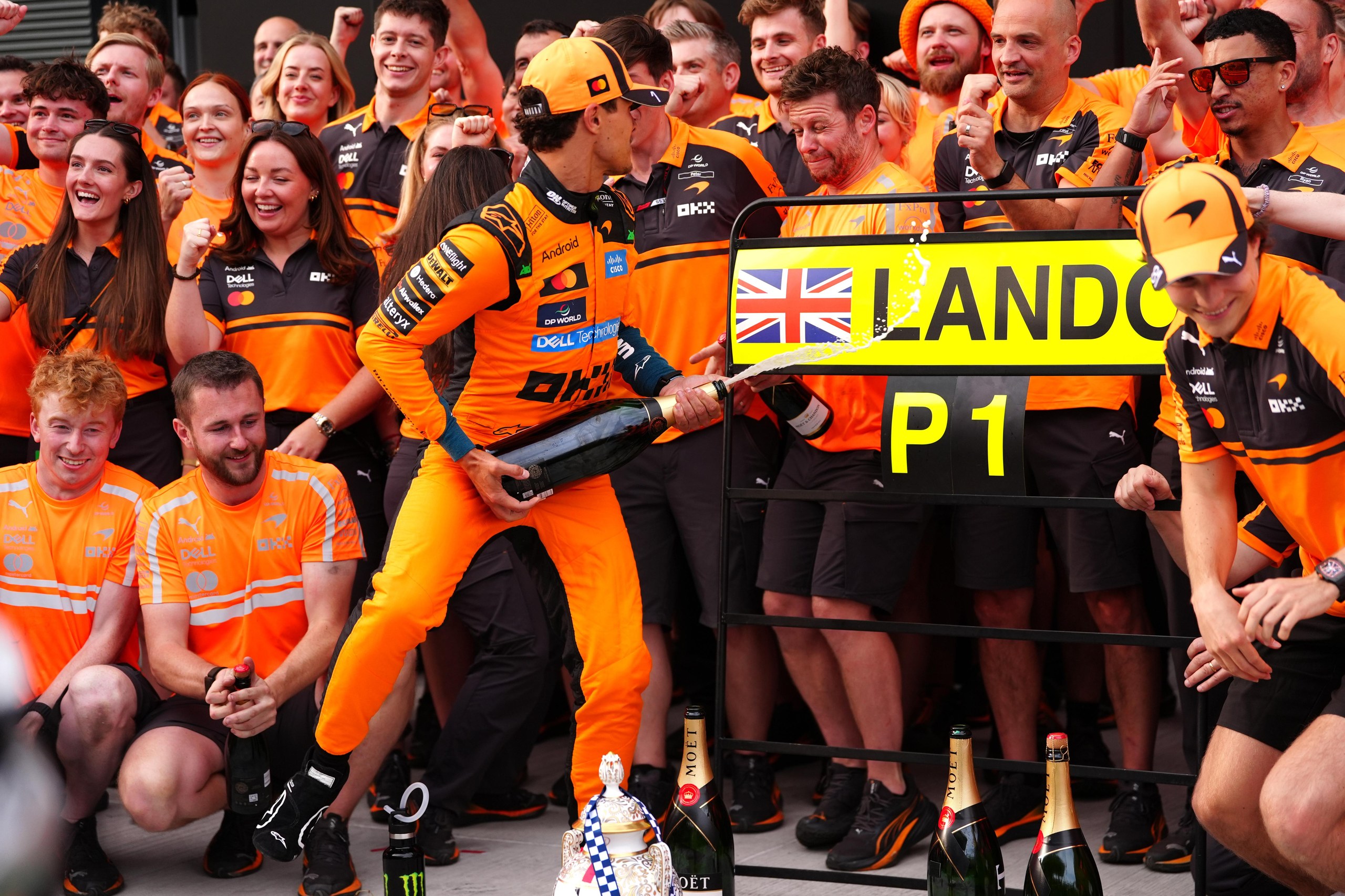 Lando Norris celebrates with the McLaren team after winning the Hungarian Grand Prix.