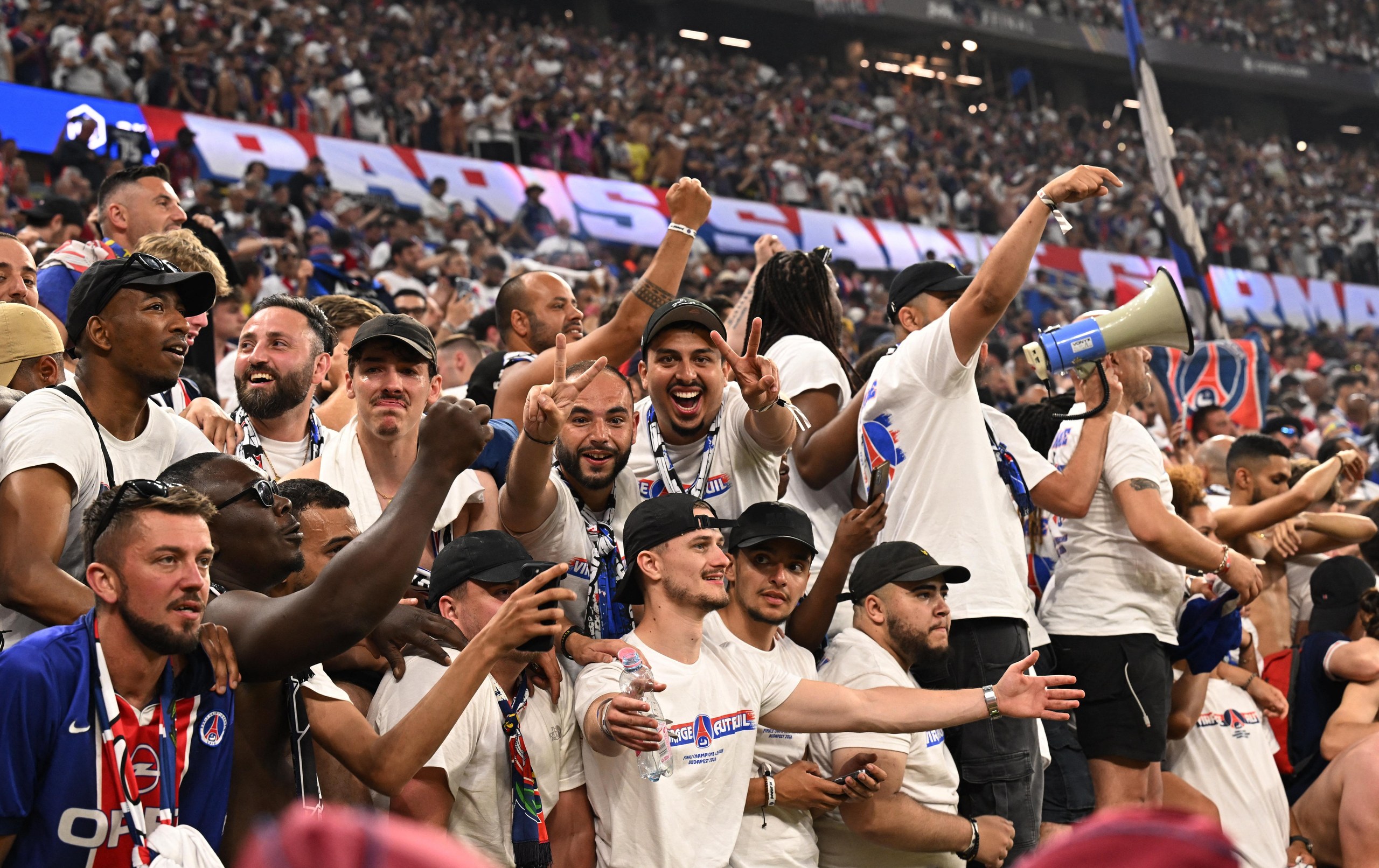 Paris St Germain fans celebrate after winning the Champions League.