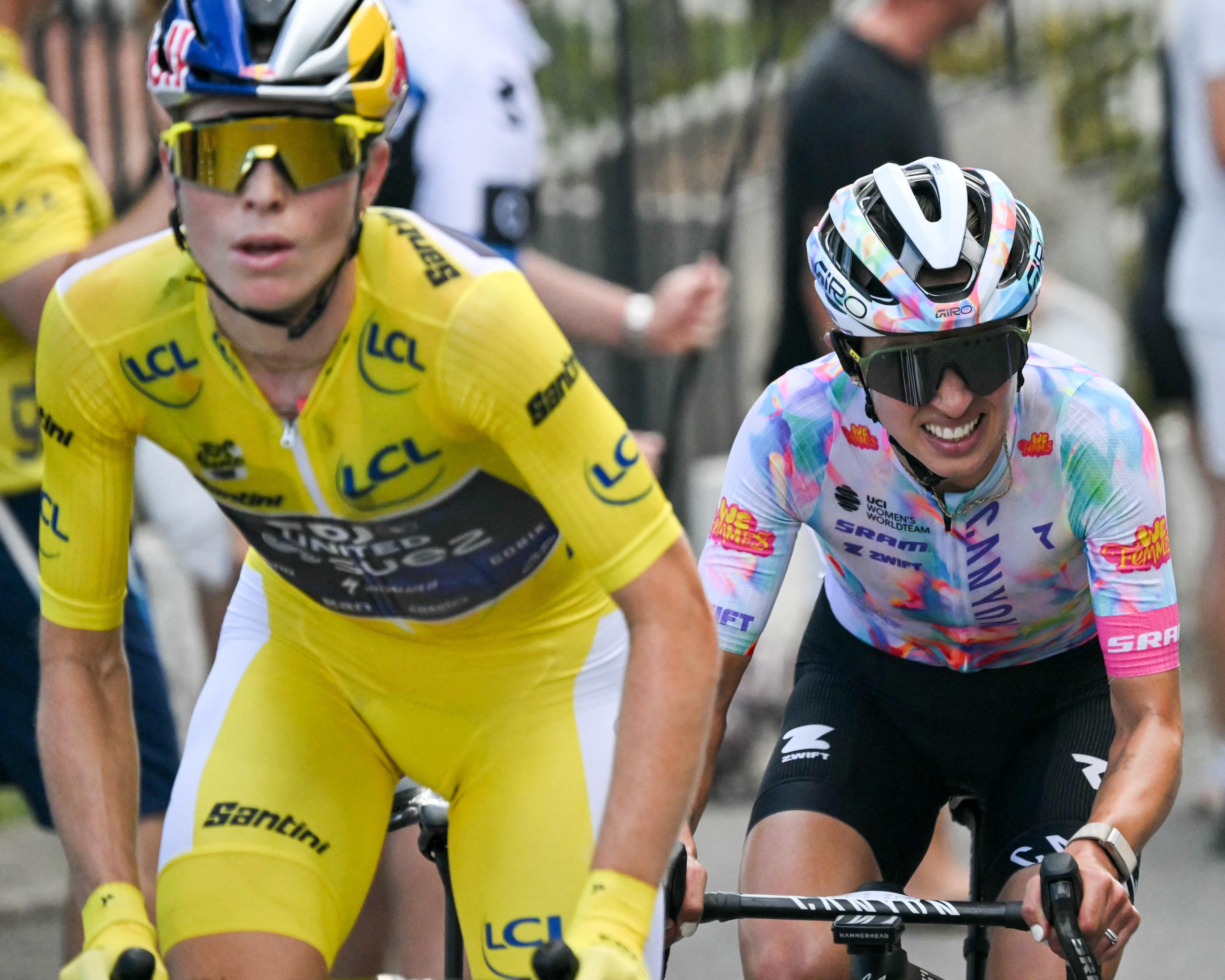 Kasia Niewiadoma (right) and Demi Vollering riding bicycles.