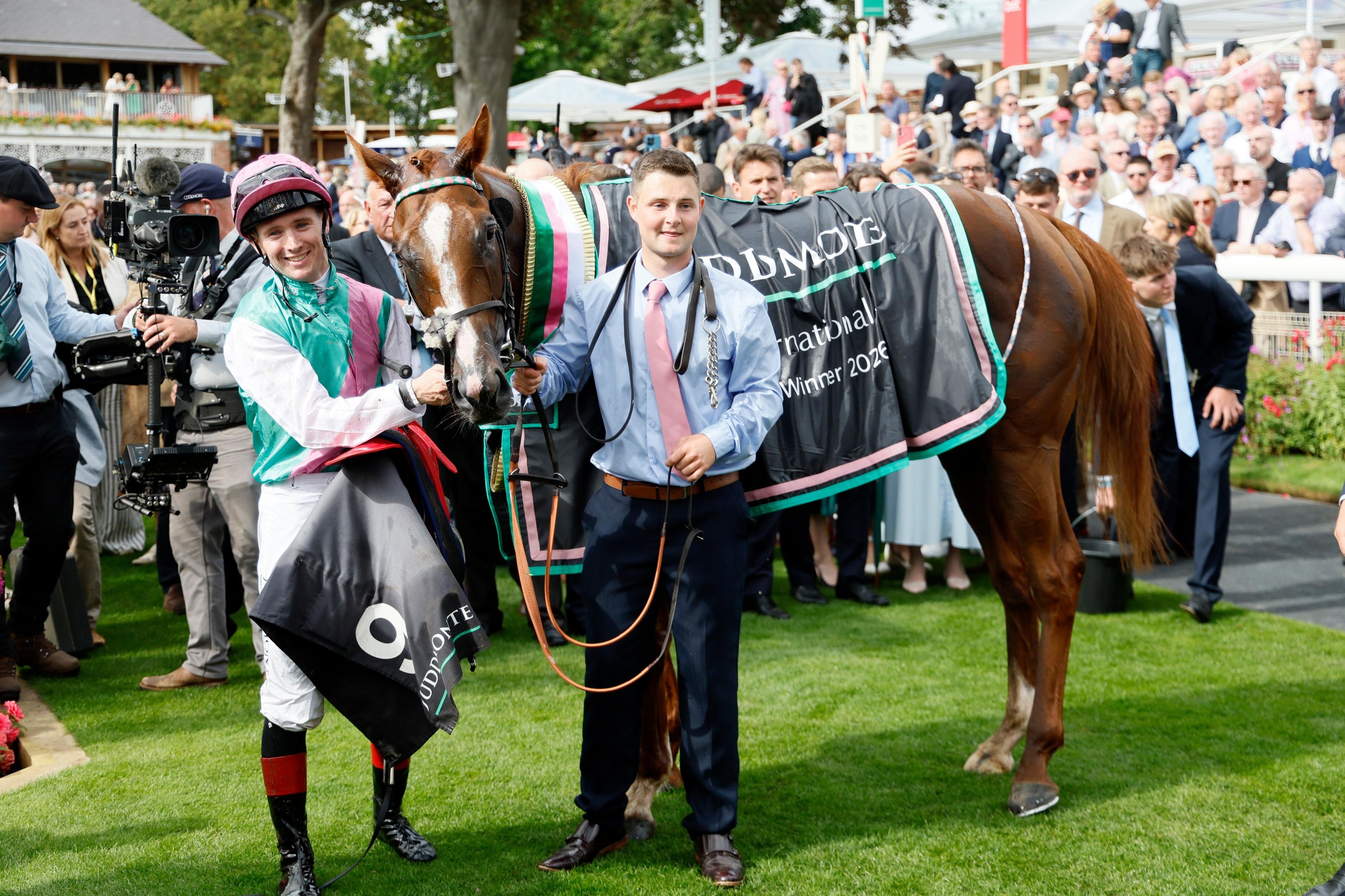 Item and jockey Colin Keane pose for photos after winning the International Stakes at York.