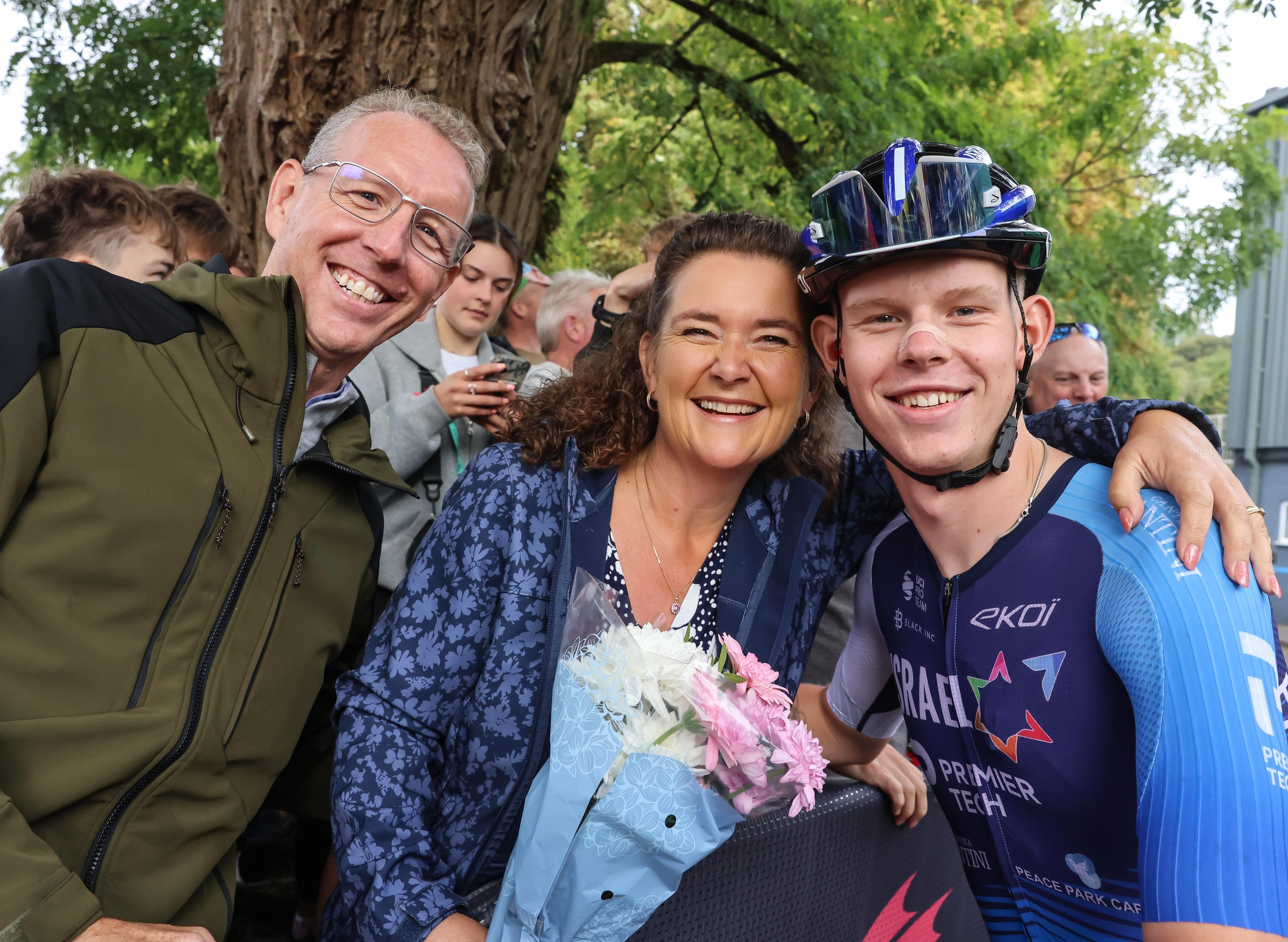 Finlay Tarling poses for a photo with his parents